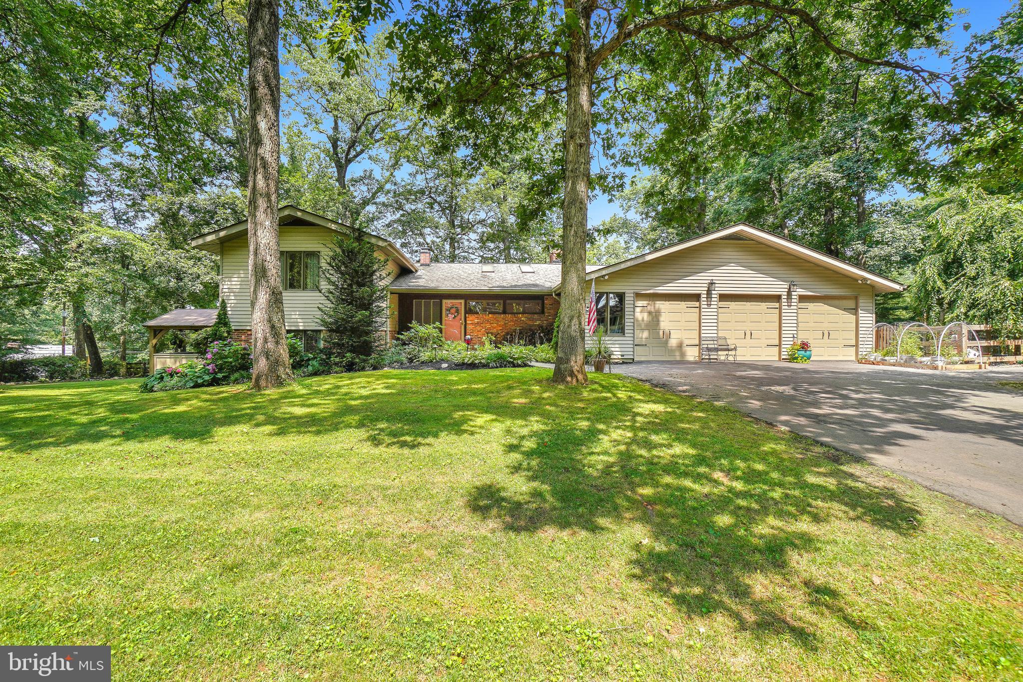 Great Family House, great Iocation, great price. Situated on nearly 3/4 acre corner lot on a cul-de-sac in
the sought after Granby Woods neighborhood. This 3400 + sq. ft., 4 level 4 bed 3.5 bath home rests on a
beautifully landscaped yard with year round blossoming plants and shrubs. Mature trees and a partially
fenced back and side yard (with three gate location access) offers a perfect place for kids and pets to
play safely. A covered front porch entry leads to an ample sized tile floor Foyer. Here you will have
access to all levels. The living space has vaulted ceiling and wood burning fireplace along with exit to the
400 sq. ft. elevated deck overseeing the back and side yards. Continue on to the large formal dining
space with access to a 10'x 12' screened porch and deck access. An all tile floor connects to the huge
eat-in Kitchen with 9' ceilings, maple cabinets, large 5'x 8' island with sink, double pantry cabinet, tile
backsplash, recessed lighting, ceiling fans and large windows and skylights making this the perfect
family gathering spot. Attached to the kitchen is a nice sized Laundry with additional tall cabinets,
counter space and large sink. The powder room connects Laundry to mud room garage and side yard
exits. All new SS appliances enhance the look of this dream gourmet kitchen. Three nicely sized
bedrooms on the upper level along with a Guest bath with tub/shower and an en-suite. All bedrooms
have double closets. A large double storage closet is located in the hall. The primary suite occupies its
own level with a beautiful six pc. Bath, exercise space and walk in closet. Additional exit to side yard and
a private covered porch with large Hot Tub make this a refuge for sure. The Family / Game room is
located at the bottom level and has a large wood burning fireplace, full sized pool table, large screen TV
with surround sound, recessed lighting and ceiling fan enhancing any family fun time. A utility area
finishes off this level including Oil Tank storage , water filtration system and updated Oil Boiler for
comfortable hot water baseboard heating. Slate paths and paved drive with turnaround connect to the
spacious three car garage housing a workshop and storage areas complete with second fridge cabinetry
and open shelving. Large windows provide great natural lighting here and auto door opener (X2) make
access easy and secure.