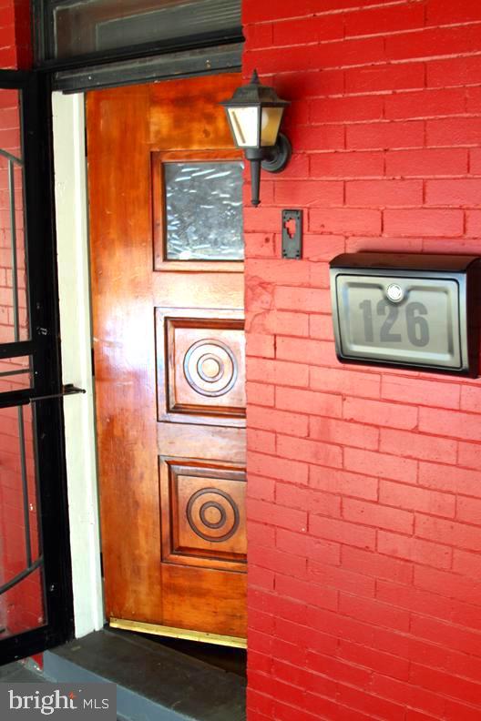 Welcome to 126 N. Sickels Street... a true gem located within eyesight of Nichols Park in Philadelphia’s Haddington section. This 3 bed, 1 bath move-in ready home features an updated kitchen with modern appliances; updated full bath; hardwood flooring throughout the 1st and 2nd floors; and a full length open concept basement that comes equip with an operable hot water tank, heating system and washer/dryer combo. The primary bedroom offers a walk-in closet, ceiling fan, and provides plenty of natural light. Natural light is evident throughout the entire home. Fencing and security doors at the front and rear of the home offer an additional level security and privacy. Schedule your showing today! Don't let this one pass you by!
