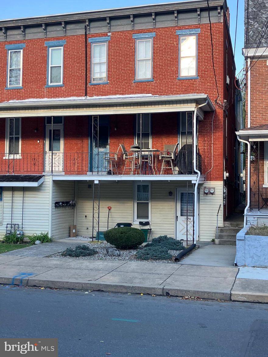 ATTENETION INVESTORS!  Don't miss the opportunity to own this recently remodeled 3 unit property located at 157 S. Charlotte St. attached to and being sold with an additional 3 unit property located at 155 S. Charlotte St. in Manheim. (see MLS# PALA2078290).
Many improvements have been added to this property in recent years including new flooring, fresh paint, vinyl replacement windows in most rooms, new appliances, and upgraded 100 amp electrical services,  Apartment B was completely remodeled in 2024 including new kitchen cabinets, countertops and appliances; new bathroom tub/shower, toilet, vanity, sink, mirror and linen closet; new staircase to second floor; new closet in primary bedroom; new drywall and paint, new flooring and new light fixtures throughout.  
Apartments A and B are heated with natural gas and apartment C is heated with fuel oil.  The exterior of the building is low maintenance brick and vinyl siding.  A coin operated washer and dryer are located in the basement laundry room.  Each apartment has one parking space located at the rear of this property.
157A is on lower level, has 1 BR, full bath and rent is $900.00/month.
157B is on middle and upper levels, has 2 BR, full bath and rent is $1375.00/month.
157C is on middle and upper levels, has 2 BR, full bath and rent is $950.00/month .   DJL