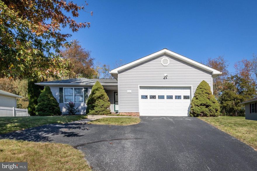 This meticulously maintained home resides in a fantastic location just inside the northern town limits of Bridgewater. Price Dr is a dead end street steps away from John Wayland Elementary and Turner Ashby High School. Highlights include one-level living, a large open great room, a private primary suite, an eat-in kitchen and laundry room. Attractive hardwood flooring is located throughout the main living areas. The bedroom in the front of the home, currently being used as an office, has direct entry to the hall bathroom offering privacy for overnight guests. A pass-through opening above the kitchen sink connects the great room when entertaining friends and visitors. The two car garage boasts an abundance of storage space. Enjoy a large rear yard that allows ample room for garden space and play.