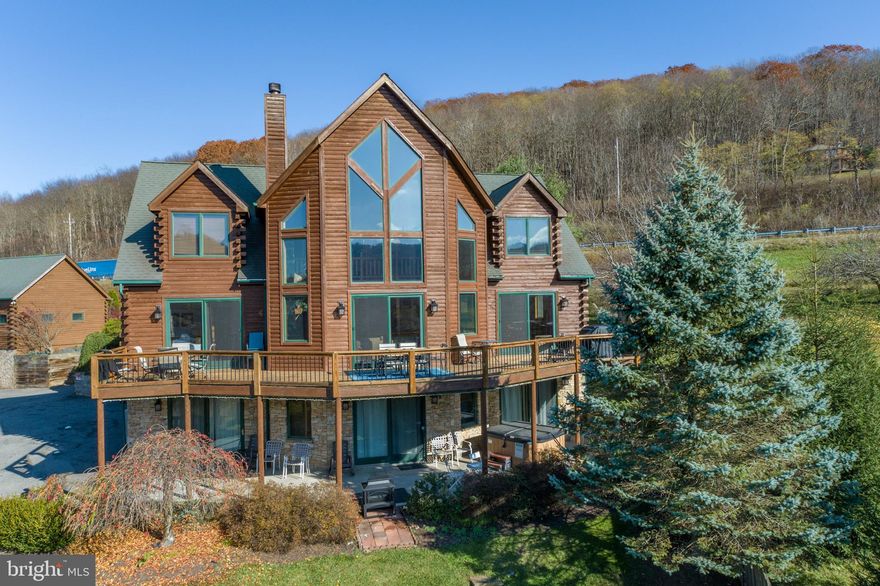 Discover Cedar Chateau, a premier vacation rental at Deep Creek Lake that offers everything you need for the ultimate getaway or investment opportunity. This stunning 8-bedroom, 7-bathroom home features breathtaking western views of both the lake and Wisp Mountain. With 6 primary suites, expansive decks, patios, and an indoor pool, it’s designed for comfort and luxury.
Inside, you’ll find beautiful hardwoods, cathedral ceilings, exposed log accents, and two impressive native stone fireplaces, creating a warm, inviting atmosphere. The spacious kitchen, equipped with two refrigerators, and dining area with seating for large groups, make it perfect for hosting friends and family.
Centrally located, Cedar Chateau is just minutes from all that Deep Creek has to offer—making it highly desirable as an established rental property, generating over $150,000 per year with no HOA fees. This is your chance to own a proven income-generator and a true gem in the heart of the lake area. Don’t miss out!