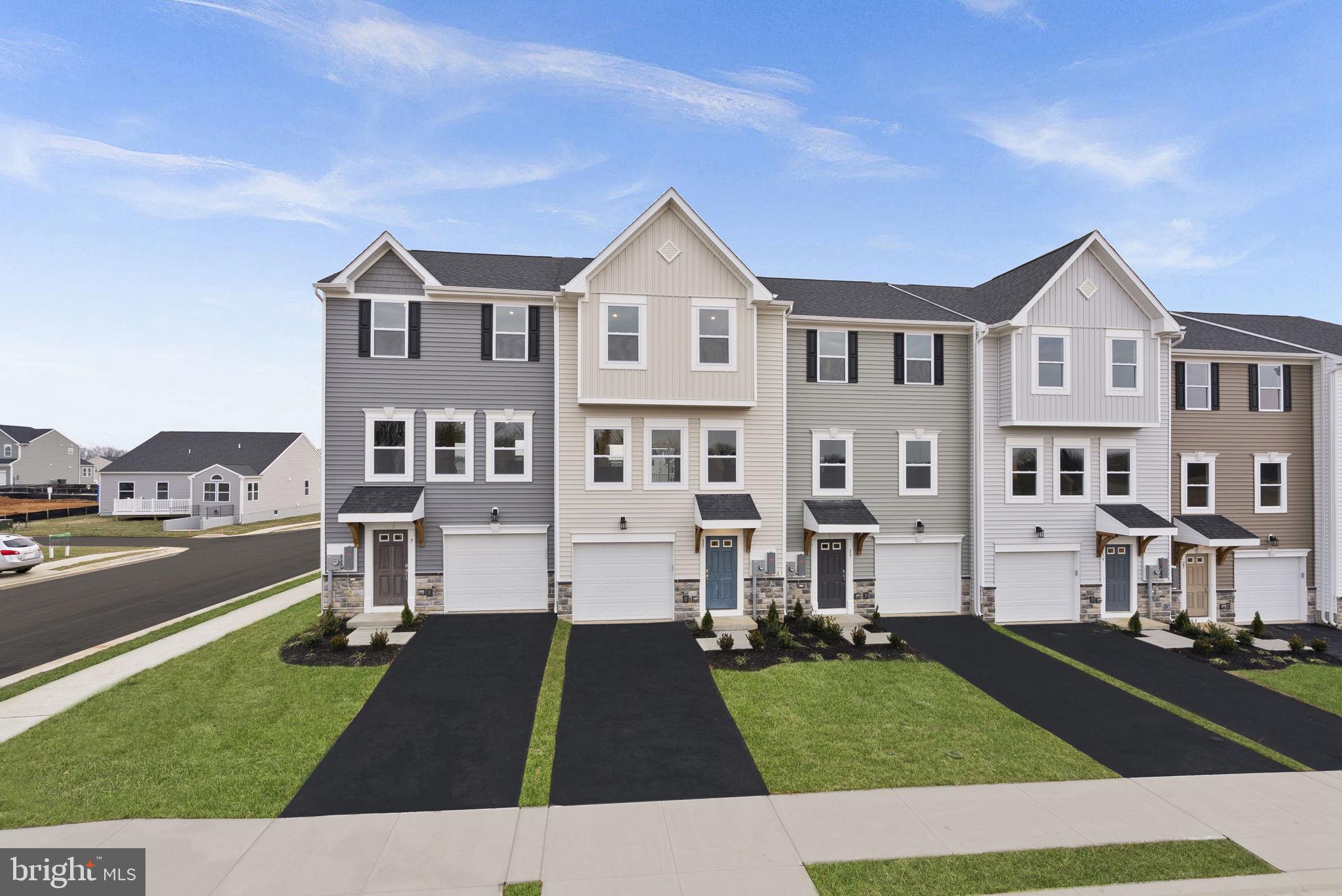 Ready This September! Don’t miss this beautifully designed St. Paul townhome by Maronda Homes in the desirable Huntwell West community of Ranson, WV. Offering 3 bedrooms, 2 full baths, 2 half baths, and a finished rec room. This home provides the perfect balance of comfort and functionality across three levels.
The kitchen features white cabinetry, granite countertops, a crisp white tile backsplash, and Samsung stainless steel appliances—ideal for anyone who loves to cook and entertain. You'll appreciate thoughtful upgrades throughout, including luxury vinyl plank flooring on the main level, enhanced LED lighting in the owner’s suite, family room, and rec room, plus 2 dual ports for added convenience.
Photos are of a similar home. Visit our model at 54 Sumter Ave, Ranson, WV. Your new home at Huntwell West is just around the corner!