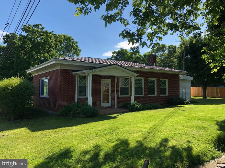 Solid as a Rock! This all brick well maintained home has everything you need to get started to home ownership. Down sizing made easy...real easy! All on the first floor, private driveway with detached garage.  Be surprised with the space of over 1400 finished square feet. Unrestricted - no HOA. Property located in Flood Zone.