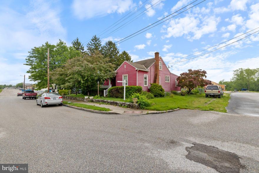 Adorable 3BR/1BA expanded Rancher located on a spacious corner lot in.  Ample parking is just steps from the covered front porch of your forever home.  Step inside to a home filled with charm, offering tons of natural light, and original hardwood floors.  The main living space features a large living room, spacious dining room and kitchen.  The kitchen offers plenty of cabinets and counter space, and a double sink under a window.  Just off the kitchen is an enclosed sunroom which leads to the amazing yard space. Down the hall are two sizable secondary bedrooms, a large primary bedroom, and a full bath.  The lower level is unfinished with laundry, storage, and tons of possibilities for additional living space. The yard is filled with tons of green space, a shed, and a detached one-car garage. The finished attic space could be used for a 5th bedroom.  This home is ideal for any new home owner and is in close proximity to shopping, restaurants, and commuter routes.   This is an estate sale. The home will be sold as is.