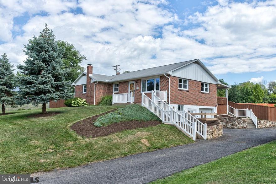 Absolutely a MUST SEE - All brick ranch home on a .3 acre fenced corner lot bordering the Spring Creek Elementary School.  The main level boasts a bright spacious living room open to the dining room which is open to the huge kitchen.  Off the kitchen you can relax on the covered back deck that overlooks the landscaped entertainment friendly back yard. This solid home features a modern finished walk out lower level that includes a large den/ rec room w/ wood burning stove and stone hearth surround, a renovated full bath, renovated laundry/storage room and door to the 1 car oversized garage.  Central Air, tons of parking in the driveway/garage and shed also included!!!  This is the house you have been waiting for!  Very close to PSU, Downtown State College and shopping.