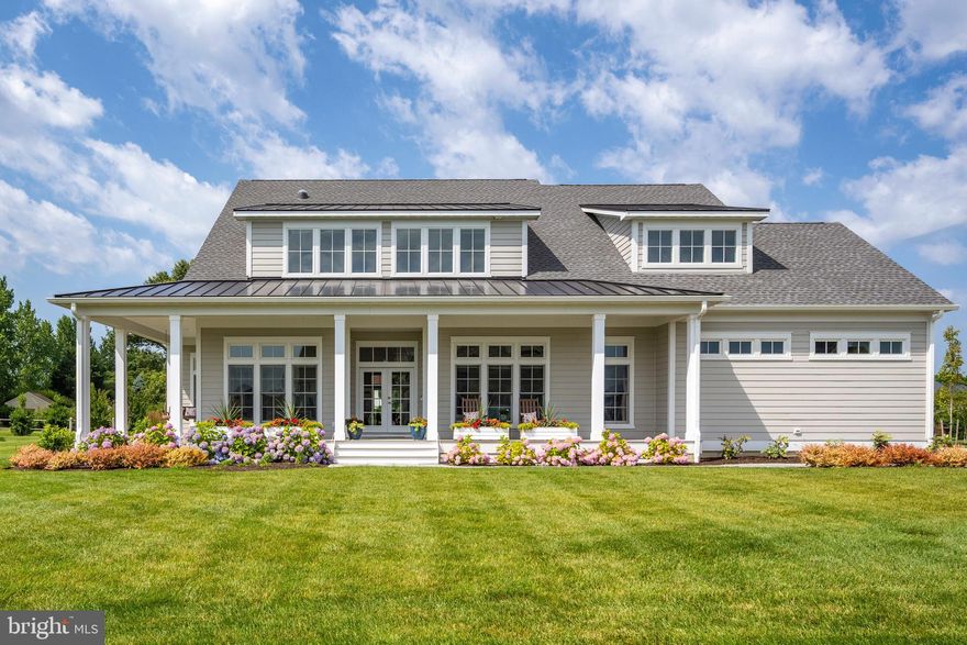 Experience luxurious living in the sought-after community of Showfield, located in historic Lewes, Delaware! This beautiful 5-bedroom, 4.5-bath home looks and feels like a model! A true highlight is the wall of windows along the back of the home, which allows for tons of gorgeous natural light to flood the kitchen, dining, and living areas. The tray ceiling in the main living space gives this home a sense of luxury that you can’t find just anywhere! The kitchen includes upgraded appliances, a long breakfast bar with seating, timeless white cabinets, and a stunning gray tile backsplash. The open living space features gorgeous touches and a gas fireplace, creating a coastal oasis feel. Want to take the relaxing one step further? That’s what your in-home sauna is for! All four bedrooms, including the primary, are large and spacious, but if you need additional bedrooms for guests or family, there is plenty of space to add 2 or 3 more on the second floor. There is also a ready-to-finish rec room and under-slab piping installed for a bathroom in the basement. The opportunities to customize this home are endless! Store your vehicles in the spacious two-car garage, complete with two electric vehicle chargers. Relax with neighbors and friends on the large open front porch while you take in the beautifully and tastefully designed landscaping of your new front yard. The back porch offers additional outside relaxing space and is equipped with electrical outlets for retractable screens and radiant heaters. It leads to a beautiful paver patio surrounded by well-designed landscaping. This home is situated in an iconic and amenity-rich community along Gills Neck Road in Lewes, right next to a beautiful 16-acre natural pond and part of the Junction & Breakwater Trail. Enjoy community amenities like a clubhouse, resort-style outdoor pool, wooded walking trails, ponds, and more. You can also either bike or drive the short distance to the beach, Cape Henlopen State Park, or visit the world-class restaurants and shopping in downtown Lewes. This beautiful home provides all of the coastal luxury you’ve been looking for! Schedule your private showing before someone snatches it off the market!