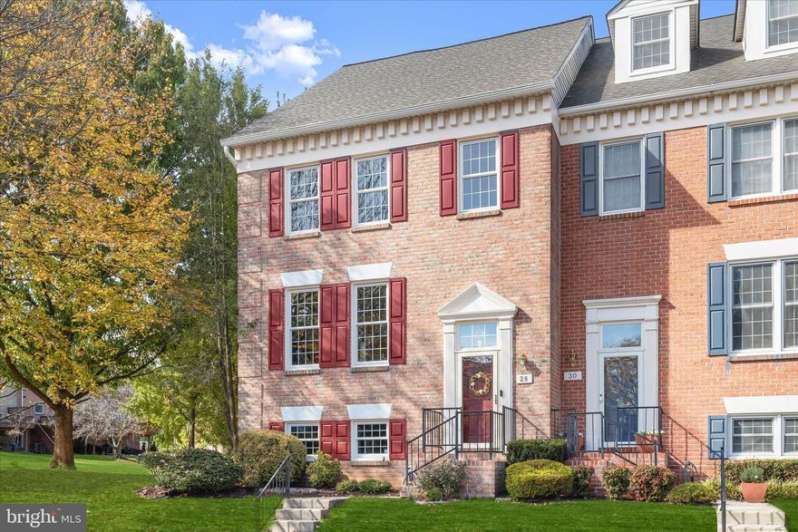 Welcome to the sought-after Chapelgate community of Lutherville-Timonium! This beautifully maintained end-unit brick townhome offers three levels of exceptional living space with elegant updates and timeless charm.  Step inside to find a bright and open main level featuring a spacious living room with gorgeous hardwood floors, crown molding, and high ceilings that seamlessly flow into the dining area adorned with chair railing and a large picture window showcasing serene views of mature trees. The chef’s kitchen is a true highlight, boasting granite counters, stainless steel appliances, soft-close drawers, a decorative backsplash, a breakfast bar, a pantry, and a sunlit breakfast area with access to the spacious deck overlooking landscaped grounds, perfect for entertaining or relaxing outdoors. Retreat upstairs to the luxurious primary suite, complete with a vaulted ceiling, double closets, and a versatile loft area ideal for an office or private sitting space. The en-suite bath offers a jetted soaking tub, walk-in shower, and expansive vanity. Two additional bedrooms and a full hall bath complete the upper level.  The fully finished lower level provides endless possibilities, featuring a bedroom with chair ledge detailing, a powder room, and a cozy family room enhanced by custom wallpaper, a gas fireplace with a brick surround, remote, and wood mantle, and walkout access to the patio and flower beds.  Additional highlights include assigned parking for two vehicles and major recent updates: The entire roof, water heater, HVAC (lower level), sliding doors in the kitchen and family rooms, all windows, a fully renovated kitchen including granite counters and newly installed cabinetry and sink, installed new exterior siding using durable, low-maintenance permanent materials around the window openings on the loft area, and water service line.  Enjoy peaceful living in a prime location with easy access to I-95, I-695, and I-83, plus the shopping, dining, and charm of Lutherville-Timonium just minutes away!  IMPORTANT NOTE: The floors shown in the living and dining room photos reflect the previous hardwood floors. These rooms have just been updated with brand-new, high-end luxury vinyl flooring for a fresh, modern look and updated photo will be available soon.