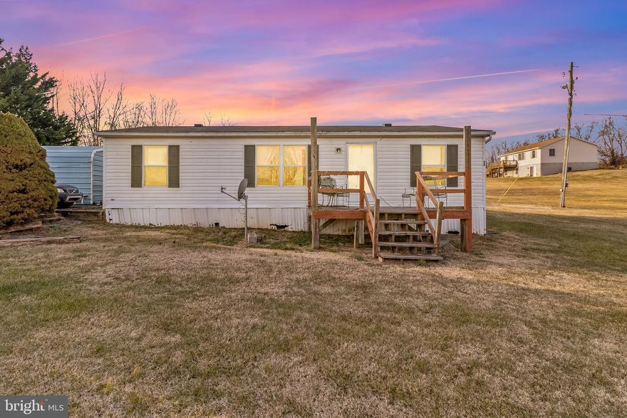 Welcome home to 88 Chett Drive in Hedgesville, West Virginia! Situated on .98 of an acre with NO HOA, this property gives you space, privacy, and freedom to truly enjoy your home. This manufactured double-wide home offers 3 bedrooms and 2 full bathrooms with no lot rent—you own the land! Recent updates include a new roof (2025), new flooring and carpet, and a new asphalt driveway. The HVAC system is just 4 years old and comes with a 10-year warranty. Enjoy the savings of a private well and septic, meaning no water or sewer bills. Plenty of outdoor space, low expenses, and move-in ready, this one checks all the boxes!