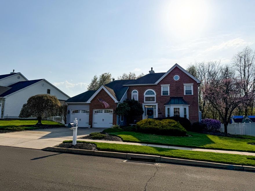 Welcome to this beautifully maintained brick-front home in the desirable Durham Meadows community, ideally situated on a spacious lot with a fenced-in backyard and two-car garage. Offering approx 2,600 total SF of living space, including a finished basement, this home combines timeless character with functional living.

Step inside to a grand two-story foyer featuring elegant crown molding, chair rail, and traditional architectural millwork that carry throughout the home. The formal living room showcases a truly special focal point—a historic fireplace mantle dating back to the 1890s—adding warmth and unique charm. The adjacent dining room features well-maintained hardwood flooring, perfect for hosting.

The kitchen offers classic oak cabinetry, granite countertops, and a functional layout that opens to a bright eat-in area and family room. The family room boasts vaulted ceilings, a wood-burning fireplace, and sliding doors leading to a covered deck—an ideal space for outdoor entertaining and enjoying the private backyard.

The finished basement was featured in Home & Gardens magazine as a ‘Guy’s Space,’ showcasing its unique, pub-style design. Complete with a built-in bar, gas fireplace, and cozy entertaining areas— its the perfect space for game days or relaxing evenings. This level also includes a flexible bonus room with closet, suitable for a home office, guest space, or additional storage.

Upstairs, you’ll find three bedrooms, including a spacious primary suite with en-suite bath and his/hers closets. All bedrooms feature ceiling fans, and one bedroom has been thoughtfully designed as a home office with custom built-ins, desk and detailed millwork. A second full hall bath serves the additional bedrooms, and a charming overlook provides a view into the family room below.

Throughout the home, buyers will appreciate the pride of ownership and meticulous care that has gone into maintaining and curating each room. This is a home that has been truly loved. The seller is relocating to be closer to family and is offering a home warranty for added peace of mind.  PLEASE READ AGENT REMARKS FOR SHOWING INSTRUCTIONS!