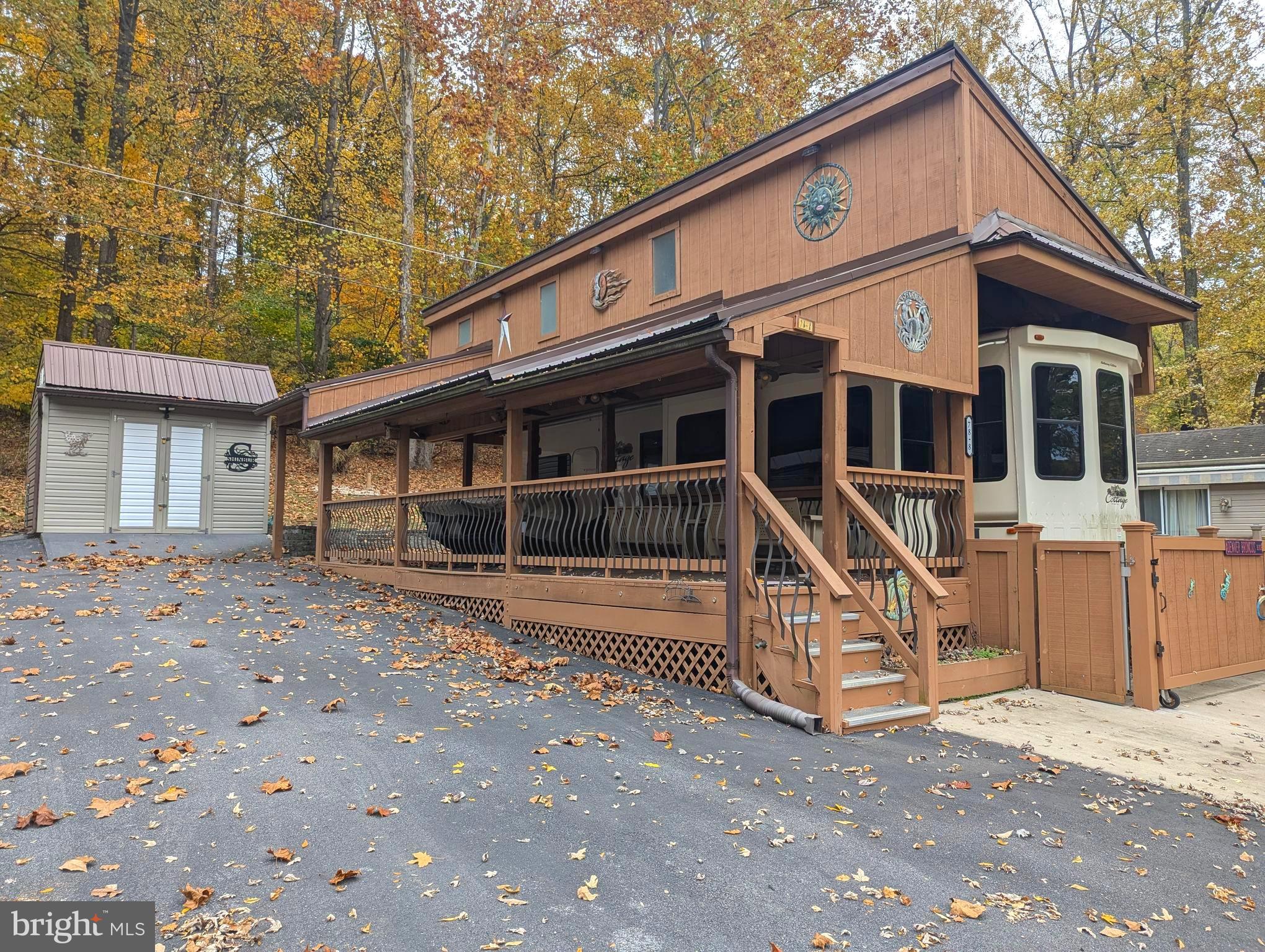 This is a gated community so you need to enter at the guard shack. Entry is not permitted without ID per the office rules. Bring ID's to the office or guard shack for visitor pass. THIS IS A SEASONAL CAMPGROUND! OPEN FROM APRIL 1 TO NOVEMBER 1. ** WELCOME TO RIVER BEND/SEASONAL LOT AVAILABLE TURN KEY** River Bend is a privately owned 400 acre recreational- vehicle camp resort with seasonal activities for members, families and guests. This great RV park is tucked away on the Upper Potomac River of West Virginia, River Bend is one of West Virginia's most popular family seasonal destinations. . Just a short drive from the Washington and Baltimore metro area. Open with utilities from April 1 to November 1. Lot owners have access to their property the entire year. *** Members Enjoy *** * Amazing views and wildlife, Potomac River access, Trails, Swimming pools, Mini-Golf, Youth center, Tennis and basketball courts, laundry facilities, convenience store, deli and lounge. *Bath houses through out the park, boat ramp, bar and grill and even a church located on the grounds. River Bend also hosts numerous activities such as 4th of July fire works, small carnival, bonfires, poker runs, horse shoe tournaments, car show, Halloween Trick or Treat and so much more. ***Property Details *** Come and relax and watch the boats go by with this river view lot. This lot comes with a 2016 Hathway Edition Aluminum Structure Cottage Camper by Forest River. This camper is equipped with a washer & Dryer, electric fireplace, large side by side frig with freezer on the bottom, dishwasher, 4 seater dinette, central vac system, plenty of storage throughout the camper, sleeper sofa and two great leather recliners. This camper is in fantastic shape. This lot also comes with an outdoor kitchen with its own 20 gallon water heater. Comes with outdoor furniture. This camper is covered with a pavilion with a metal roof and a shed to store any extra belongings. All you need is to bring your personal belongings and live the river life. Great long lot with a grassy area in the back to walk your fur baby's. Lot has asphalt and a private stamped concrete area in the back for your gatherings . Come and check out this amazing lot **** Lets bring an offer to to table! ***BRING YOUR BEST OFFER*** YOU WON'T WANT TO MISS THIS ONE.***
This lot also has two more lots on each side of this lot that are for sale so you can bring the entire family. Seller also has lots on each side of this one that are for sale. Block 78 Lot 7.
