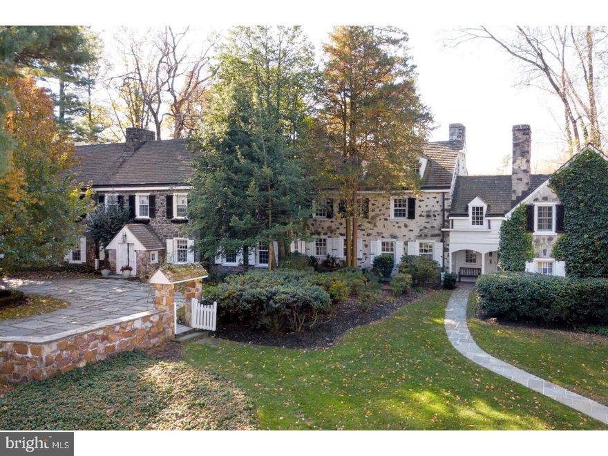 One of the few remaining Main Line estates which can boast about its proportional grounds.  The peaceful surrounding 7.49 rolling acreage is located in one of the most prestigious areas of the Main Line.  This 97-year-old stone colonial designed by well known, Wm. Brognard Okie, has beautifully maintained the integrity of its fine craftsmanship while having all of the modern improvements, amenities and clean updates incorporated. The property includes 12 fireplaces, generator, 3 car heated garage and an additional 3 car garage with possible 2 Bedroom studio above, pool house with full kitchen, fitness room with spa.  The enormous central entrance hall with walk-in fireplace greets and leads to each of the beautifully appointed areas of the home, one of which is the bright gourmet kitchen and breakfast area which looks out onto the pool and pool house. Both kitchen and breakfast area adjoin the family room and large butler's pantry.  The master suite is an inviting haven with 2 fireplaces, his & her dressing areas, sitting room/office and a fully updated master bath including sauna.  Secondary bedrooms each have tastefully updated bathrooms.  At the other end of the house and attached to the kitchen is a wing which could be nanny, in-law or exquisite guest suite.  This family and the other former families including "Happy" Rockefeller have had many happy memories in this understated Main Line estate.