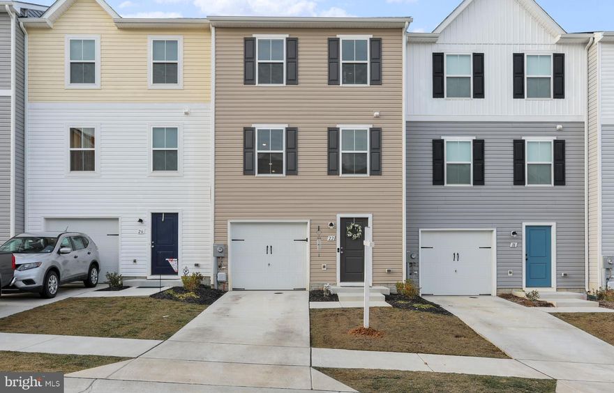 QUICK MOVE IN! This is the ONLY townhome currently available in the Dillon Farms community! This beautiful home is only a year old. The 3 finished levels include a modern, open floor plan & luxury vinyl plank flooring. On the 1st level you will find a single car garage, foyer, laundry with new washer and dryer, and a fully finished BONUS room with access to the backyard.  Do you have pets or little ones? No worries-the backyard has a new, vinyl privacy fence! Back inside, on the 2nd level you will find a spacious family room that flows effortlessly into the kitchen and dining area. The kitchen is equipped with stainless appliances, loads of beautiful white cabinets, AND a pantry for plenty of storage.  Another amazing feature of this great kitchen is the huge island with seating for 4! Adjacent from the dining area is a convenient powder room for guests. Head upstairs to your own private oasis. The primary suite has a large walk-in closet and ensuite bath! Down the hall you will find 2 more spacious bedrooms and another full bath. This home is tastefully decorated with neutral colors just waiting for you to make it your own. The best part is getting a new construction home WITHOUT the wait! Don't wait-schedule you're showing today. This home will not last! *Room sizes are approximate