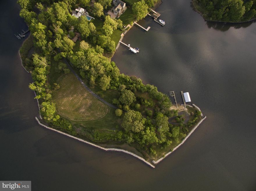 Premier gated homesite with over 2000' of waterfront on the scenic South River offers endless possibilities.Build your dream home on this stunning private 8AC peninsula&enjoy beautiful sunrises & sunsets. 25mi to BWI, 30mi to DC &room for a helicopter pad.The huge views, protected deep water, 2 piers, sandy beach&coveted boathouse makes this one of finest waterfront sites in the region.Sold AS IS.