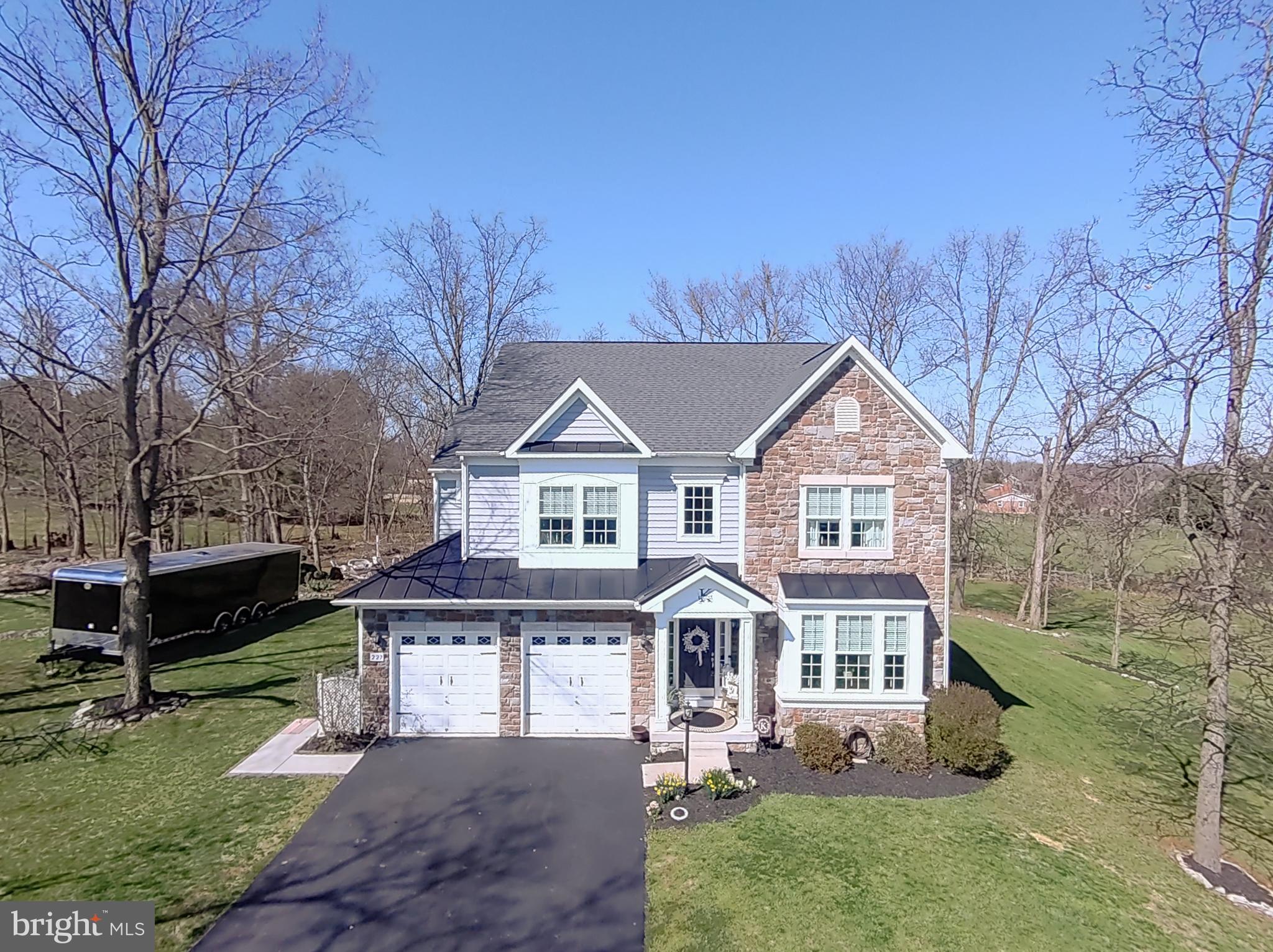 HIGHEST AND BEST BY 1PM SUNDAY 4/7/24...This exceptional colonial-style home embodies timeless elegance with its meticulously crafted details and picturesque setting. As you step inside, you're greeted by an abundance of natural light that illuminates the spacious rooms that are adorned with hardwood floors, crown molding, and intricate finishes. The feature wall serves as a focal point, adding character and depth to the living space, while the center staircase offers a grand entrance. Every corner of the property reflects careful planning and design, from the thoughtfully landscaped grounds to the secluded backyard that backs onto a tranquil wooded area, creating a private oasis. The stone fireplace provides a cozy gathering spot for chilly evenings, while the expansive rear deck offers ample space for outdoor entertaining and enjoying the park-like surroundings. With a finished lower level providing additional living space and an attached garage offering convenience, this home is not just aesthetically pleasing but also functional and practical. It's a place where every detail has been considered to create a truly exceptional living experience.
