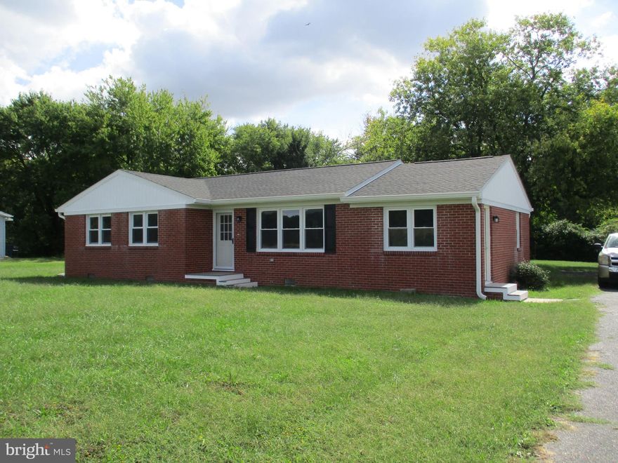 Custom Brick rancher, close to town on large lot. Open floor plan, spacious kitchen, stainless steel appliances, large island. 3 bedrooms, 2 baths, sunroom overlooking yard.  Upgrades include new windows, CAC, new roof new electric service and plumbing 
New Septic and Well, Closing help will be considered