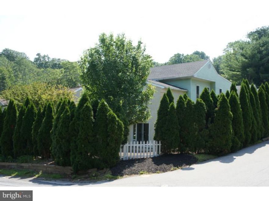 This fantastic and beautifully unique home is close to Media Borough and within walking distance to Moylan/Rose Valley Train Station. It has been completely rehabbed (still a work in progress...updated photos to follow). Some of the features include all new carpeting; freshly painted interior; double pane windows throughout; new light fixtures throughout; Master Suite with vaulted ceiling, walk-in closet, additional double closet, ceiling fan, elevated Sitting Room with hardwood flooring, and a private Bath; 2nd Bedroom with two closets and ceiling fan; 3rd Bedroom with premium cork flooring and double closet; Foyer with tile flooring and double coat closet overlooking the Living/Dining Room and lower level Family Room; the Living Room & Dining Room feature premium cork flooring with access to the brand new exterior Patio; Kitchen with skylight, tile flooring, stone & glass backsplash, and stainless steel appliances including gas range, side-by-side refrigerator/freezer & dishwasher. The Kitchen gives access to the walk-out Basement. Step down to the sunken Family Room which has a gas fireplace with direct vent, recessed lighting, and access to the Laundry Room (high efficiency washer/dryer) & Powder Room. There is also a Sun Porch located off the Family Room with tile flooring and an abundance of windows including a 'pet window'. The exterior features a newly paved driveway, Patio, and freshly seeded grounds. On the other side of Levis Rd, there is a moderately used building occupied by Hedgerow Theater. They are very 'quiet neighbors'!