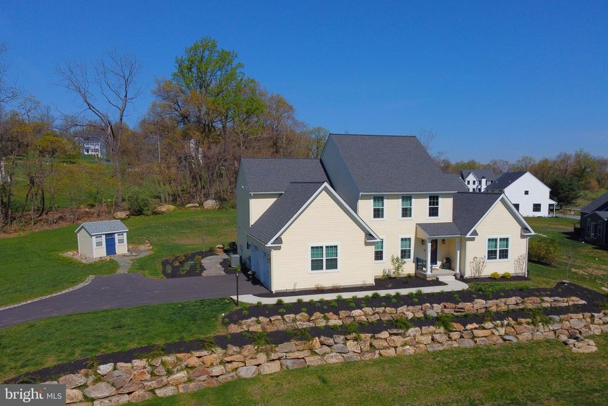 Welcome to the prestigious Vistas at Longridge, where comfort, space, and convenience come together in this beautifully maintained 4-bedroom, 2.5-bath home set on a serene one-acre lot. Designed with both functionality and style in mind, this home features a desirable first-floor primary suite, offering ease and privacy. The en-suite bath affords separate sinks, water closet plus walk-in, tiled shower. The bright, open floor plan is bathed in natural light and anchored by a cozy fireplace—perfect for relaxing evenings at home. The spacious kitchen provides abundant cabinet and countertop space, ideal for everyday living and entertaining alike. Upstairs, you’ll find three generously sized bedrooms, offering flexibility for family, guests, or a home office. The basement includes an egress window, presenting excellent potential for additional finished living space. Step outside to enjoy the beautifully crafted natural stone patio and matching walkway—perfect for outdoor gatherings or quiet moments surrounded by nature. Additional highlights include a 2-car garage, storage shed, and a peaceful setting tucked away from the hustle and bustle, yet conveniently located near shopping, schools, and major routes. Don’t miss the opportunity to call this exceptional property home—schedule your private showing today!