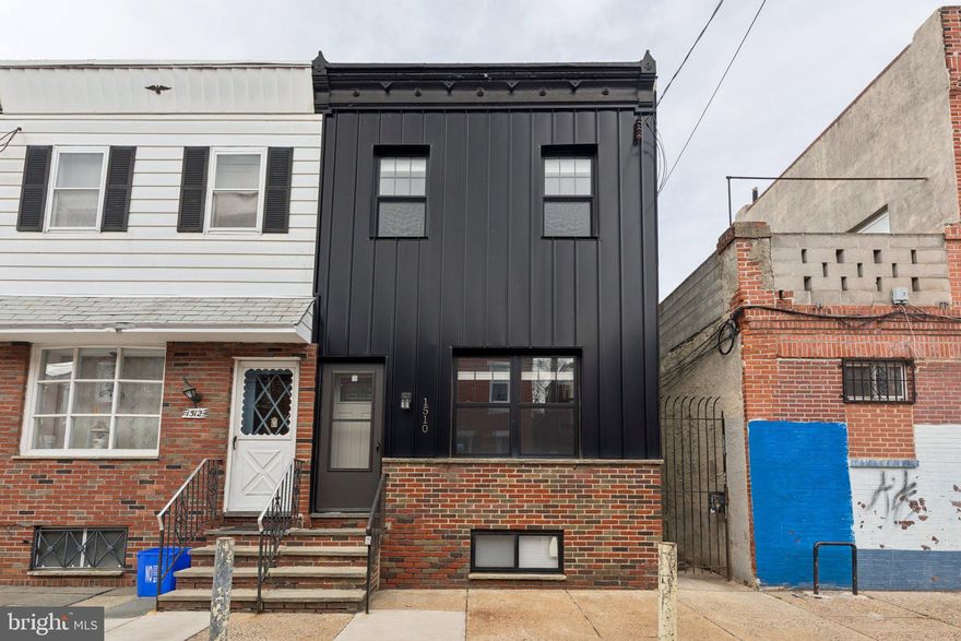 Welcome to 1510 S Carlisle Street, a beautifully renovated and expanded 3-bedroom, 2.5-bath home in the heart of Point Breeze, offering modern design, thoughtful finishes, and incredible indoor-outdoor living, plus the added benefit of approximately 6 years remaining on the tax abatement.
Just 4 years young and fully renovated from top to bottom, this home immediately stands out with its striking contemporary façade and clean architectural lines. Inside, you’ll find a bright, open-concept main level designed for today’s lifestyle. The spacious living and dining area features rich hardwood floors, recessed lighting, a ceiling fan, and an abundance of natural light, along with a convenient powder room.

The chef’s kitchen is both stylish and functional, complete with quartz countertops, marble tile flooring, a sleek tile backsplash, and a generous breakfast bar that opens to the dining area. High-end stainless steel appliances include an induction range with exhaust hood, dishwasher, refrigerator, built-in microwave, wine cooler, and garbage disposal. A rear door leads to an exceptionally large private yard, perfect for entertaining, gardening, or creating your own outdoor oasis.

The finished basement offers valuable additional living space, ideal for a den, family room, home office, or gym. It also includes a mechanical area with gas hot air heat, central air, electric hot water tank, updated electric panel, and a dedicated laundry area with washer and dryer. Additional storage space, including a closet under the stairs and utility storage areas, adds everyday functionality.

Upstairs, the second floor features a desirable and flexible layout. The rear bedroom suite includes wood floors, recessed lighting, ceiling fan, closet, and sliding glass doors leading to a private terrace. The en-suite bath is beautifully appointed with marble tile flooring and a stall shower. A middle bedroom makes a perfect office or nursery, while the front bedroom offers generous space, a double closet, and excellent light. A second full hall bath with quality tile finishes and a double hall closet complete this level.

Located just steps from Broad Street, this home offers easy access to Center City, public transportation, dining, and neighborhood favorites.

Modern, move-in ready, and ideally situated, with significant tax savings still in place, this is city living at its best. Schedule your showing today, this one won’t last long.