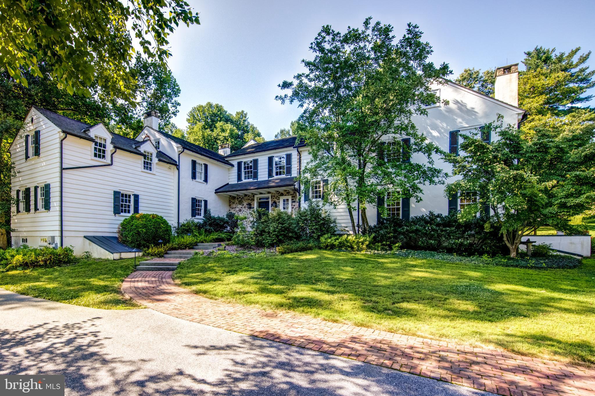 Welcome to Beagle Hill Farm, where country living is both exhilarating and luxurious in this spectacular farmhouse estate home. The original was built in 1821 with additions in the 1930 s and 1950 s. In 2005, new owners hired a Philadelphia and New York based architect, Christopher Tantillo, to blend the architecture together in a way that kept the historic nature intact. Modern features were introduced to the quaint farmhouse with the goal of creating a home that was comfortable and luxurious, but not ostentatious. The farmhouse is ideally sited on 14.81 glorious Chester County acres. A private lane takes you over a creek and past the fish filled pond to the main house and the Belgian block motor court. Upon entering the home, you are greeted by a large entrance hall, graced by a custom elliptical shaped staircase. The elegant moldings, custom millwork and architectural features arouse your expectations of what s to come. The front-to-back living room has a gas fireplace, chair rails, random width hardwood floors and a wall of windows that bring the outdoor terrace and gardens into the room. The adjacent dining room has French doors to the patio and a dramatic black-and-white marble radiant heat floor. The gourmet kitchen features custom cabinetry, top of the line appliances, extra-large granite counters, both farmhouse and prep sinks and opens to the bright family room with fireplace and breakfast room with heated floors and magnificent garden views. The living spaces continue into the original 1800 s wing of the home, the current den, with large original cooking fireplace, deep and rounded window sills and refinished antique wood floors. The adjacent 1930 s addition has been transformed into a billiard room with exposed stone wall and leather floors. The hand-crafted elliptical staircase leads to the second-floor residence spaces with gorgeous wood floors throughout all of the 5-6 bedrooms. The master bedroom suite has vaulted ceilings, gas fireplace with slate surround and wood mantle, large walk-in closets, a stunning tiled master bath with jacuzzi tub, oversized steam shower with marble seat, separate lavatory and two separate vanities. The 1950 s wing encompasses two bedrooms (one currently used as an office) and a shared hall bath. The laundry room is also efficiently located on the second floor. Bedroom 4, overlooking the rear gardens, is equipped with an ensuite bath perfect for guests. Bedrooms 5-6 are a perfect 2-bedroom in-law or auPair suite with full bath. The finished lower level includes a 1300 bottle, wine cellar, decorated with a tile mosaic of one of the formal gardens, and a cork floored tasting room for sampling your collection. You can exercise in the rubber floored gym or grow and nurture specimen plantings in the garden growing room. The outdoors at Beagle Hill Farm are made for living and entertaining. A blue stone terrace runs the entire length of the back of the home allowing for access through multiple rooms. Most stone used to construct the beautiful walls and fireplace were gathered on the property during construction. The terrace was made for country living with many options; relaxing near the soothing fountains, in front of the two-story stone fireplace, or hosting a dinner party for friends and family. But the outdoor options are just beginning; dive into the huge blue salt water pool and relax in the bubbling spa; play a tennis match on the turf court or practice your basketball skills on the sports court. The 5-acre wild flower field is also sure to entertain; follow the meandering paths watching nature unfold throughout the seasons. The home has numerous outbuildings including a Bank Barn that houses a 4-car garage, 3 stall barn and caretaker s cottage; a workin metal forge; pool cabana also a utility shed for the industrial-sized generator and pool equipment. This Chester County farmhouse estate is ready for its next story. Will you be in it?