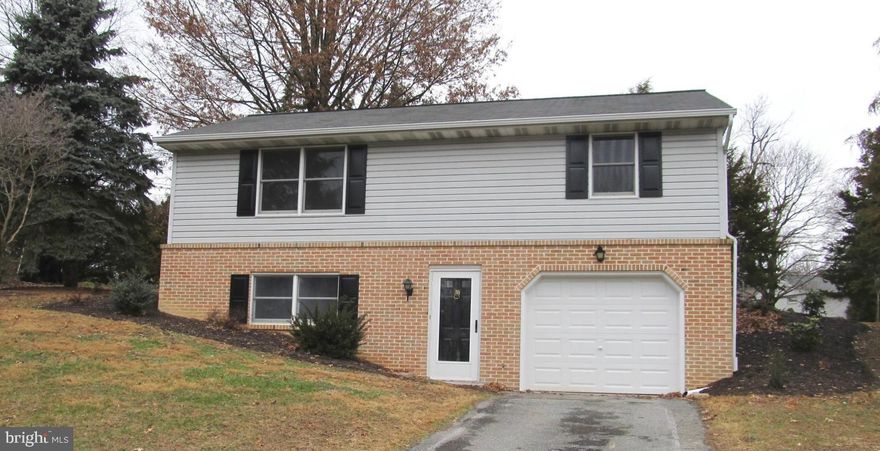 Raised Ranch Style home, with new appliances, including the Refrigerator.  Central Air and Heat Pump.  New Hardwood floors main floor and Laminate 1st floor.  Two full baths.  Oversize one car garage with new door.  18' x 11'6 Living room with doubole window.  Sliding doors from Dining to Deck.  New carpet.  Large lot at the end of the Cul De Sac.