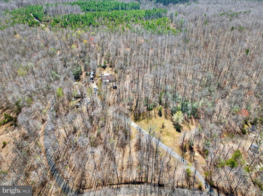 Original Owner Home - Lovingly Maintained - Peaceful and Serene Setting Along Dead-End State Maintained Road - Very Private - NEARLY 14 ACRES OF GROUND - Property Backs To 160+ Acre Single Owner Property - Rappahannock River Just To The North And Rapidan River Just To The South Of Property - 3 Bed 2 Bath Home With Large Covered Front Porch And Koi Pond - Lovely Place To Take In The Outdoors And All Virginia Nature Has To Offer - Ample Wildlife - Several Outbuildings For Many Different Uses - Stick Built Chicken Coop Tucked Away In The Woods - Farm steading, Hunting, Orchard....If You Can Dream It Up This Property Can Make It Happen - Large Covered Rear Porch - Above Ground Pool And Deck - Fruit Trees - Properties Like This Don't Come Around Too Often!