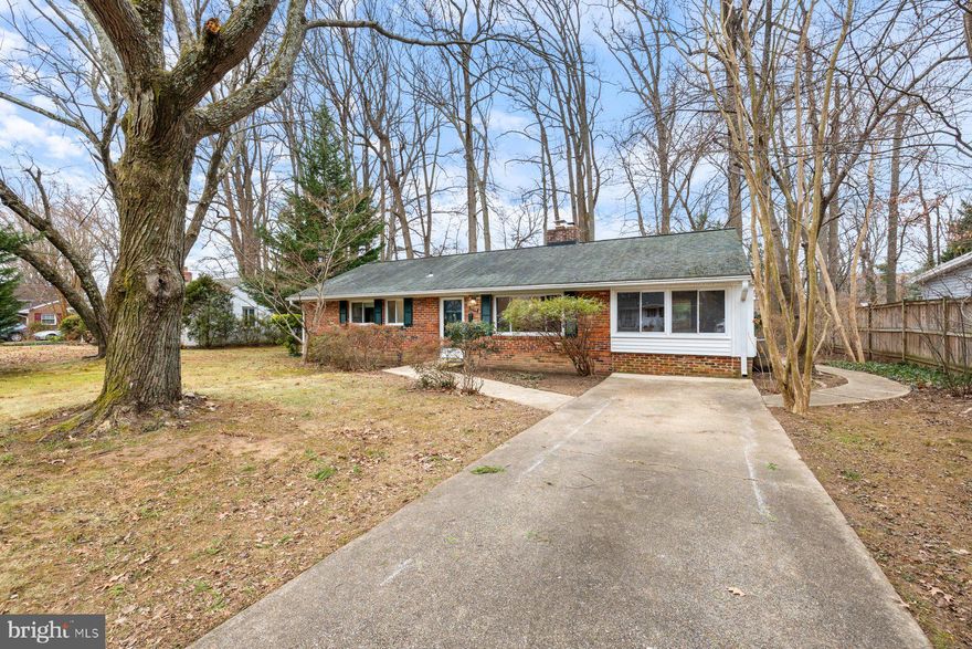 Opportunity knocks in Springfield! This three-bedroom, one-bath home offers a fantastic chance for buyers looking to personalize a property and add value. Tucked away on a quiet street in a sought-after neighborhood, the home delivers privacy, potential, and a prime location.
Inside, you’re welcomed by a spacious family room featuring hardwood floors and a cozy wood-burning fireplace, perfect for chilly evenings. A partially open layout connects the dining area and kitchen, creating an easy flow. The kitchen offers serene views of the backyard, while an additional living space just off the kitchen provides flexibility for entertaining, a home office, or a casual living space. A separate room dedicated to a washer and dryer adds every day convenience and functional space.
A sliding door from the dining area opens to a flat, tree-lined backyard ideal for entertaining, play, or simply relaxing outdoors. Hardwood floors run throughout the home, and three bedrooms along with a full bathroom complete the interior layout.
Situated on a generous 0.25 acre lot, the outdoor space offers mature trees that provide natural shade and a cooler, more private setting with room to garden, play, or expand your outdoor living vision. The exterior offers great curb appeal with a shaded front yard framed by mature trees and a wide, extended driveway providing ample parking. The location truly shines just minutes off I-495 and Braddock Road, with an easy commute to Washington, D.C., and close to shopping centers, grocery stores, and tons of great restaurants.  The home feeds into highly ranked schools including North Springfield Elementary School, Holmes Middle School, and Annandale High School. This is a great chance to renovate and create your dream home in a wonderful neighborhood. Quick closing is preferred.  Some photos are virtually staged.  Book your appointment today!