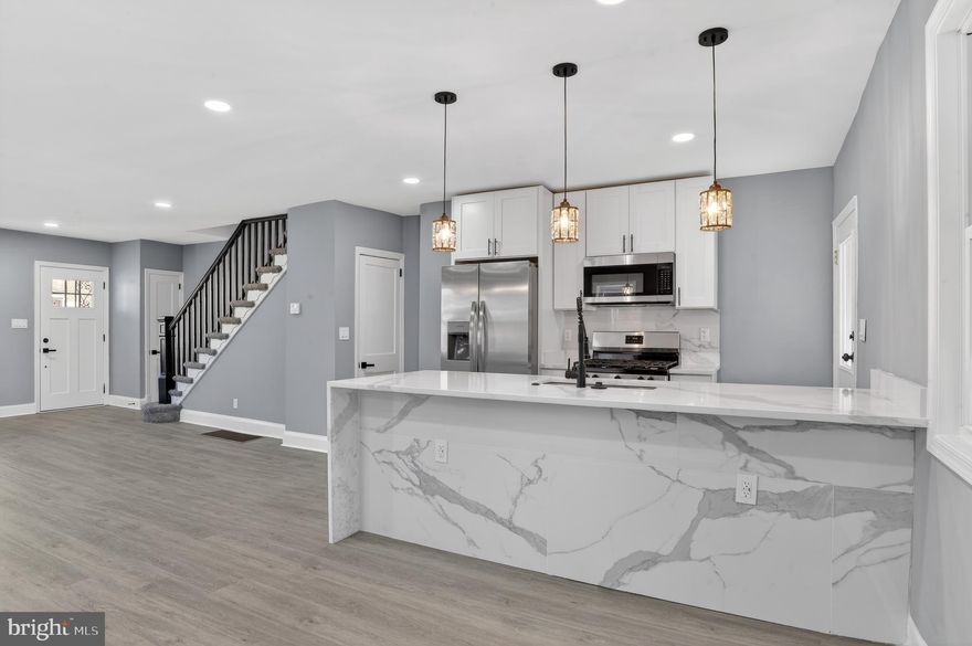 This beautifully remodeled end-of-row home offers 3 bedrooms and 2 full bathrooms, showcasing modern style and comfort from top to bottom. Recent updates include fresh paint, new carpets in the bedrooms and basement, new flooring, recessed lighting, all-new windows, a new A/C unit, updated plumbing, and an aluminum coating applied to the roof for added durability.
The stunning kitchen features brand-new cabinets, quartz countertops, and modern appliances, along with a new washer and dryer for added convenience.
Located in a highly convenient area near shops, dining, everyday amenities, and just minutes from Downtown Baltimore, this move-in-ready home combines high-quality renovations with an exceptional location. A must-see!