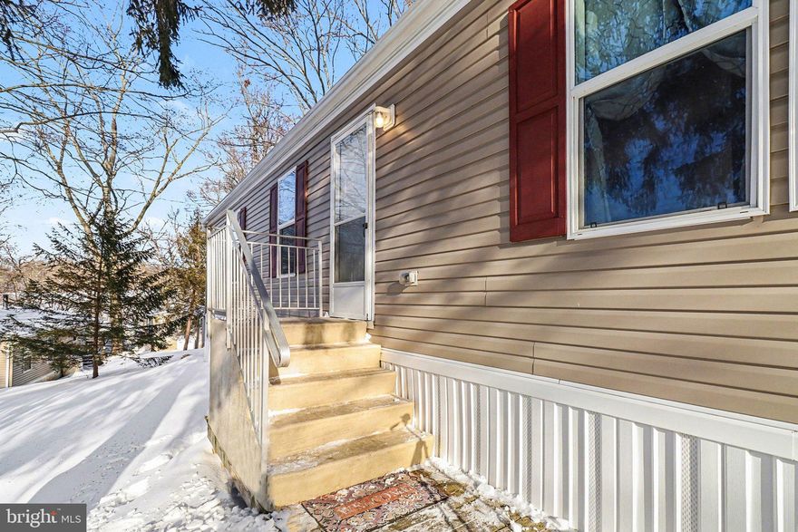 Welcome to 404 Dogwood Lane, a beautifully maintained 2017 manufactured home in Tamarack MHP.  This home offers 3 bedrooms and 2 full bathrooms with a modern, open-concept design. Step inside to find 8' ceilings, a bright and airy layout, and oversized vinyl windows that flood the home with natural light. The heart of the home is the spacious kitchen, featuring a stunning center island, stainless steel appliances, and beautiful cabinetry -  perfect for everyday living and entertaining. Just off the kitchen is the primary suite, complete with a large garden tub and a brand-new vanity.  On the opposite end of the home, you'll find two additional bedrooms, a second full bathroom, and a convenient laundry area. The home has been freshly painted throughout, giving it a clean, move-in-ready feel.  All appliances and the shed are included in the sale. As an added bonus, the seller is offering a one-year First American Home Warranty for the buyer's peace of mind.  Don't miss this opportunity to own an affordable, stylish, well-cared-for home in a convenient New Providence location!