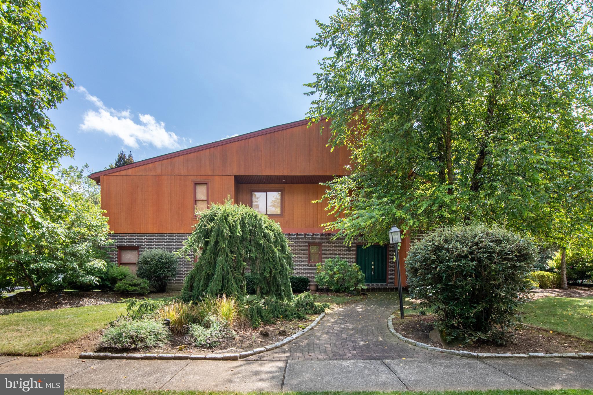 Step inside this spacious 5-bedroom, 3.5-bath contemporary home! Built in 1978, it was designed ahead of its time with an open-concept layout, soaring ceilings, and natural light pouring in from every angle—perfect for today’s lifestyle. The living room and dining room are bright with vaulted ceilings . The Kitchen offers an eat-in breakfast area. The family room, complete with a cozy brick fireplace, offers the perfect spot to gather or unwind. A first-floor laundry adds everyday convenience. Enjoy early morning coffee in the beautiful sunroom. Upstairs, the bedrooms are generous in size, including a primary suite with a private bath and large walk-in closet—your own retreat at the end of the day. The 5th bedroom with full bathroom also works beautifully as a home office if you need flexible space. And don’t miss the walk-up attic—ideal for all your extra storage needs. Outside, you’ll find a 2-car garage and beautifully landscaped grounds designed by Plantique, featuring hardscaping that creates the perfect backdrop for relaxing or entertaining. All of this in a mature, established neighborhood while still being close to shopping, dining, Wegmans, Trexler Park, and major routes for an easy commute. Easy access to PA Turnpike, Rt 22, Rt 309 and I-78. Parkland SD, Springhouse and Parkway Manor schools.