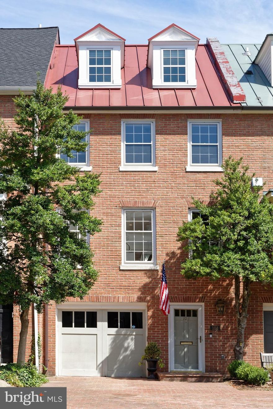 Beautifully refreshed, this distinguished 4-bedroom, 4.5-bath residence in the heart of Old Town offers a seamless blend of timeless elegance and sophistication.  As you step inside, you're greeted by a welcoming foyer that leads to a versatile first-floor bedroom or office, complete with a gas fireplace and French doors opening to a private flagstone patio.  This level also boasts a newly renovated full bath featuring heated floors, a seamless glass shower and contemporary fixtures.  Enjoy the outdoors on the serene patio with a new wood fence, perfect for relaxation in a peaceful setting. The open-concept main level is an entertainer’s dream, featuring gleaming hardwood floors, a wood-burning fireplace, and handsome moldings.  The spacious living and dining areas flow effortlessly into a chef’s kitchen, equipped with a large island with seating, top-of-the-line appliances, and a wet bar with a beverage cooler.  The dining area includes built-in cabinetry for ample storage.  Step outside to a newly renovated Trex deck and wrought iron railing to enjoy a perfect setting for al fresco dining and hosting gatherings.  A convenient powder room completes this level.  The upper floors are home to three well-appointed bedrooms and three full bathrooms, ensuring privacy and comfort for family and guests.  The top-floor primary suite is a serene retreat, offering multiple closets and a luxurious en-suite bath.  Located just one block from the scenic Potomac River, this home offers unparalleled access to the Old Town waterfront, unique shops, and gourmet restaurants.  This property is a true gem, offering a refined lifestyle in an unbeatable location.
A one car attached garage plus driveway parking for a second car completes this unique property.