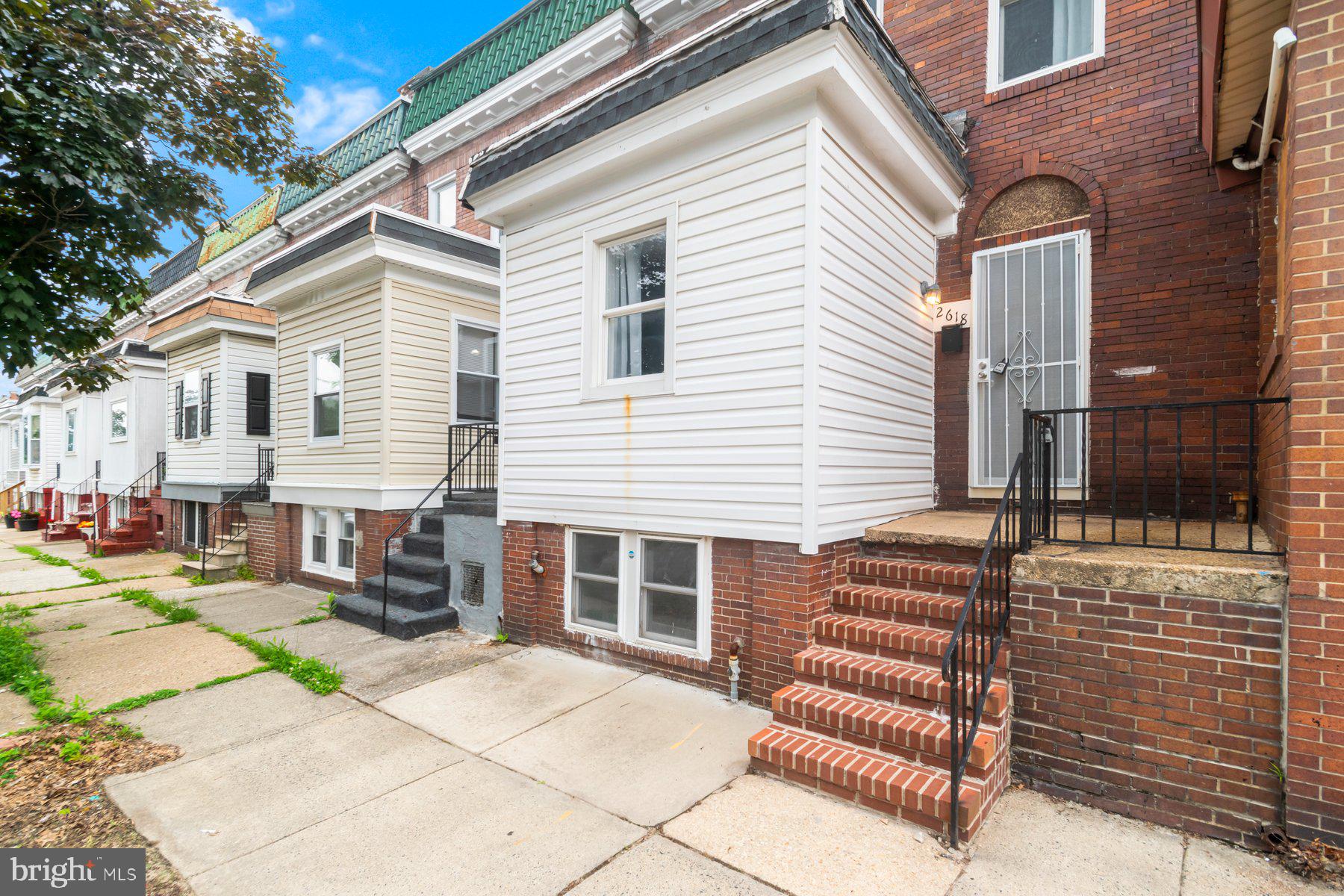 Beautifully renovated and move-in ready 4BR/3BA Townhome located on a tree-lined street in East Baltimore Midway. Make your way to the spacious front patio and open the door into your forever home. Step inside a home filled with tons of natural light, a soft color palette, luxury flooring, and the open floor plan home owners are seeking. The main floor features a large living room open to the dining room and kitchen. the kitchen offers plenty of cabinets, a gas slide in range, granite countertops, and an island with pendant lights and breakfast seating for two or more. On the second floor are two sizable secondary bedrooms, a large primary bedroom, and a newly remodeled full bath. The lower level is finished offering an additional bedroom, laundry, a full bath with walk-in shower, and storage. From the kitchen step outside to a semi-fenced yard with a large patio, green space, and so many possibilities. This home is move-in ready and ideal for any new homeowner, and is located in close proximity to shopping, restaurants, and commuter routes.