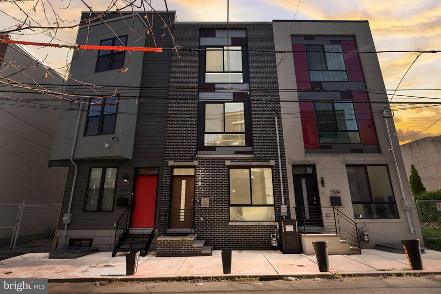 Welcome to 1528 W Seybert St, a beautifully maintained 3-story townhome built in 2020 offering modern city living in the heart of Philadelphia. This newer construction home features stylish finishes, contemporary fixtures, and thoughtful upgrades throughout, all kept in excellent condition. The spacious layout offers comfortable living across multiple levels, while the finished basement provides additional flexible living space perfect for a media room, home office, gym, or guest area. Enjoy a private rooftop deck with fantastic views of the Center City skyline — the perfect space for relaxing or entertaining. With modern design, updated systems, and low-maintenance living, this move-in ready property offers the ideal combination of comfort, style, and city convenience in a rapidly developing neighborhood.
