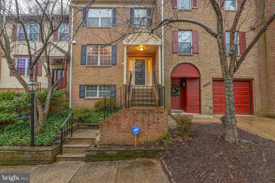 Lovely brick front townhouse backing to trees in a great location!  Walk to bus stop, close to 495 and Van Dorn Metro Station.   Beautiful hardwood flooring in foyer, kitchen and dining room.   Inviting sunken living room with wood burning fireplace will take you out the sliding glass doors to your private patio.  Primary suite includes his and hers closets and an en-suite bath.