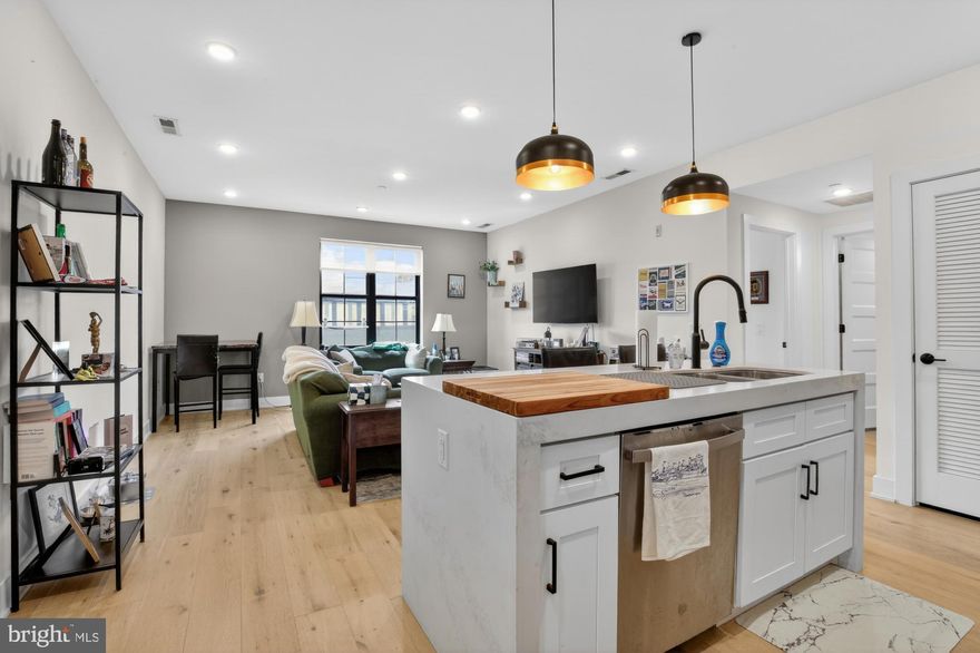 3.5 years left on full 10-year TAX ABATEMENT! Welcome home to Fishtown Station—where modern design meets one of Philadelphia’s most dynamic neighborhoods. This 2-bedroom, 2-bath condo nearly 1,000 square feet of thoughtfully designed living space in the heart of Fishtown.

Inside, hardwood floors run throughout an open-concept layout filled with natural light. The kitchen is both stylish and functional, featuring stainless steel appliances, a gas range, quartz countertops, a sleek tile backsplash, and an island with seating—perfect for everyday living and entertaining. Solid construction materials ensure for a peaceful and serene experience inside.

The split-bedroom floor plan provides ideal privacy, with each bedroom positioned on opposite sides of the unit. The primary suite includes a walk-in closet and a well-appointed ensuite bathroom, while the second bedroom is generously sized and located near a full hall bath with modern finishes.

Additional conveniences include in-unit laundry, central air, and ample storage throughout.

Fishtown Station offers secure, key-coded entry, package and mail storage, bike storage, and trash/recycling chutes on every floor. Off-site parking options are available nearby for added flexibility.

Perfectly positioned between Northern Liberties and the vibrant Frankford Avenue corridor, this home places you moments from some of the city’s best dining, shopping, and entertainment, along with easy access to public transit. Just steps from Middle Child Clubhouse and other acclaimed establishments like Kalaya, Suraya, LMNO, Wm Mulherin & Sons, Frankford Hall, La Colombe, Murph's, ACME Grocery, Wine and Spirits Store, City Fitness Gym, Evil Genius Microbrew, The Filmore, Rivers Casino, and much more!

A great opportunity to own a modern condo in one of Philadelphia’s most sought-after neighborhoods. Schedule your tour today as this won't last long!