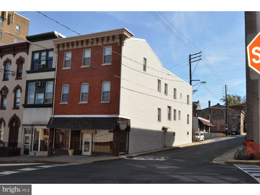 Highly Visible corner location with glass commercial storefront located two blocks from Yuengling Brewery and one block off of Centre Street.  Open floor layout on fist floor with four (4) apartments on the second and third floors.  All apartments one bedroom, two ready to go with full kitchens, two with easy conversion from office back to apartment set up.  Central Steam heat for apartments and separate metered electric.  First floor retail/office space all electric heat pump, two meters.  This building will sit across the street from the proposed new Mahantongo Parking Deck.  Building is equipped rear fire escape and fire alarm system on all floors.  Building is vacant and ready for owner occupancy or rental.