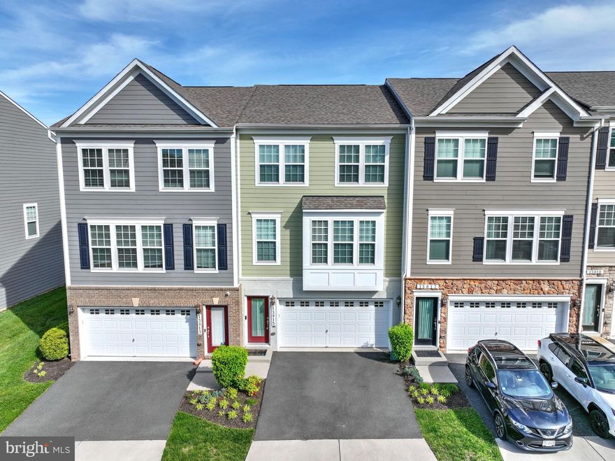 Fabulous townhome with 2 car garage!  Just 7 years old! Bright open floorplan with fantastic kitchen. 3 bedrooms, 2 full baths, and 2 half baths.  Large deck ideal for barbecues and entertaining! Neighborhood amenities include swimming pool, dog park, tot lot and lots of open space.  Great location close to shopping, parks, and major commuter routes.   Showings starting on May 16th.  Open house May 18th from 1 to 3 pm.  You'll love it!