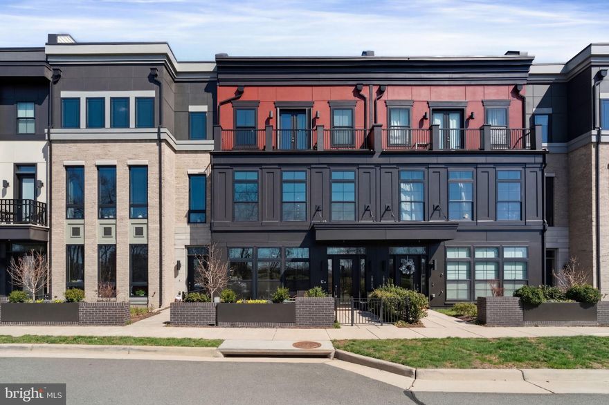 Luxury living awaits in this exceptional 4-level elevator townhome in the heart of One Loudoun. 
Beautifully positioned on  highly desirable North Park Drive, this home offers picturesque green space views and breathtaking sunsets that create a truly special setting  

The entry level provides exceptional flexibility with a private space ideal for a home office or optional main-level bedroom, complete with half bath—perfect for remote work.  Rear load garage entry leads to your separate mudroom with custom built-ins and extra storage,  10 foot ceilings on your first 3 levels and 9 foot on your 4th level, as well as a smart home automation sytem, automated window treatments, are just a few fabulous options in this beautifully customized home.

The main living level is truly the heart of the home, featuring a chef’s dream kitchen outfitted with premium Wolf appliances, Sub-Zero refrigeration, upgraded cabinetry with custom uplighting, and dual granite  islands that anchor the space. An entertainer's dream, the kitchen has a beverage station, separate wine fridge, and walk-in pantry. An inviting eat-in area around your dual islands offers additional space for casual dining and gathering. Your family room is just calling for a movie night in front of the fireplace with custom built-ins.  The thoughtfully designed open-concept layout seamlessly connects the kitchen, dining area, and living room, creating the ideal setting for entertaining or everyday living. 

The third level features a spacious and serene primary suite, thoughtfully enhanced with custom woodwork that adds warmth and a distinctive, upscale touch. The luxurious primary bath offers a spa-like retreat with a dual vanity, soaking tub, and an oversized walk-in shower, creating the perfect place to unwind. The primary walk-in closet is equally impressive, featuring custom built-ins designed to maximize storage and organization, ensuring every inch of space is both functional and beautifully tailored.
With stylish finishes throughout and a layout designed for both comfort and sophistication, this home offers modern living at its finest.

Ready to unwind? The fourth level offers a peaceful retreat designed for relaxation and comfort. This level features a bonus bedroom and full bath, creating the perfect private space for guests.The true highlight awaits just outside—your rooftop terrace, where you can enjoy morning coffee or evening cocktails while taking in spectacular sunset views overlooking the surrounding green space. Your gas fireplace is just perfect for chilly nights, and your retractable awning is just the thing for a sunny morning.  It’s the perfect setting to relax, entertain, and enjoy the beauty of your surroundings.

Situated in the heart of One Loudoun, you're just steps away from premiere shopping, dining, and entertainment, including Trader Joe's, Barnes & Noble, and The Alamo. 

This home is what you decide it to be - a full community experience in a walkable neighborhood, and also a lock-and-leave lifestyle. This gem must be seen to be appreciated.

*** Professional Photos coming soon ****