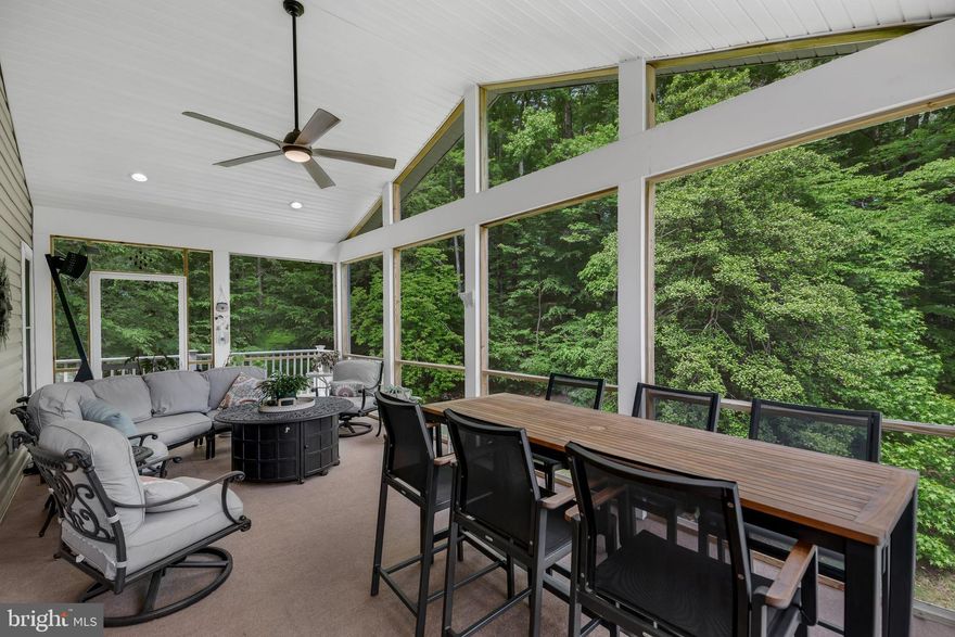 Quiet Acres is the community and aptly named!  This beautifully renovated home offers exceptional privacy on 3 wooded acres surrounded by nature. Originally built in 1979 the owners had a whole home renovation by completely gutting the home and rebuilding it in 2006,  The home features 3 bedrooms, 2 full and 2 half baths, and a large lower level family/game room.

As you enter the paved driveway you are surrounded by beautiful trees and it opens up to a spectacularly landscaped property that welcomes you home. Inside, the main level boasts luxury vinyl plank flooring, a spacious living room filled with natural light, a formal dining room, and a home office, which could be converted to a 4th bedroom. The stunning kitchen offers granite and Corian counters, custom wood cabinetry, a large island with breakfast nook, TWO sinks, built-in appliances, a built in wine rack, and multiple pantry closets. Convenient half bath, laundry room with sink and storage, and access to the carport complete the main level.

The upper level includes a large primary suite with access to the rear deck and screened porch, two walk-in closets, and a private bath with soaking tub, separate shower, and dual vanities. Two additional bedrooms share a full hall bath. The lower level features a family/game room with propane fireplace, half bath, and a climatized workshop/storage area.

More importantly, with the professionally installed solar panels that are OWNED and not leased, your electric bill will be extremely low, if any.  Additional highlights of the home include a two car carport for your crab feasts and fun events, full gutter guards, and programmable thermostats. 

Lot 11 (4.75 acres) is adjacent to this property and is also for sale.  Lot 11 may be purchased with or separately from the home to enjoy an additional vista of trees.   No HOA for this private oasis!