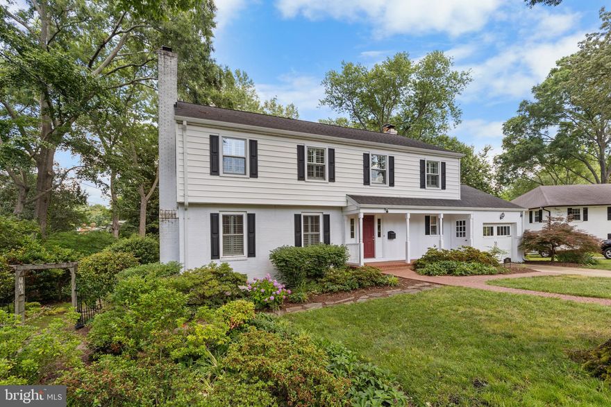 Popular Trenton model in sought after Waynewood. The leafy streets of Danton and Dalebrook provide the storybook backdrop to this renovated colonial. From the outside, you'll appreciate the handsome details including the front porch, carriage house garage door, and brick lead walk. Step inside to the remodeled main level. Enjoy one of two fireplaces on cold fall evenings (both gas). Chef's kitchen boasts stainless appliances and custom cabinetry. The whole main level has hardwood flooring and designer paint colors. Huge, conditioned sunroom overlooks the multi-tiered deck and lush 0.40 acre backyard. Two decks and patio provide lots of options for outdoor living. Upstairs you will find 4 huge bedrooms with hardwood flooring and 2 renovated bathrooms. Primary suite has sitting space that could easily be converted into a large walk-in closet. There is also a charming balcony for morning coffee. The lower level has a full basement (rare for the Trenton model) that includes a third full bathroom, recreation room with third fireplace (wood burning with new flue in 2013), second recreation space and huge office or fifth bedroom with separate entrance.  Note recent replacements include roof (2014), hot water heater (2023) upstairs heat pump (2023). This house has three total zones (most Trenton models only have one!). Outside, you will find the vibrant Waynewood neighborhood with community pool, tennis courts, playground and acres of land for walks and roaming. The GW Parkway is just a few blocks away and boasts miles of trails for running or biking. Old Town Alexandria and it's fine dining options are just 10 minutes north, but you have everything you need just 3 minutes aways at the Hollin Hall shopping center. Don't miss your chance to make this your home!