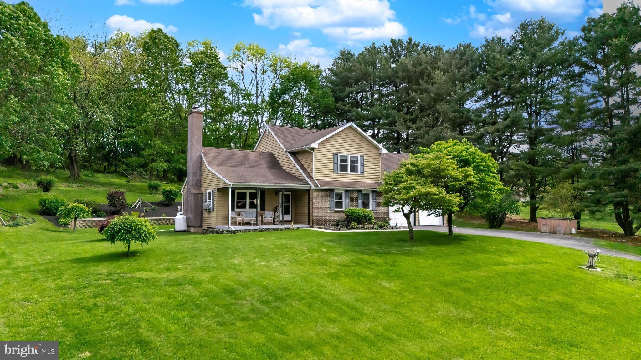 Nestled just off the beaten path​ in Alburtis Berks County yet conveniently accessible to Lehigh Valley and major routes, this lovingly maintained 4-bedroom, 2-bath home offers the perfect combination of privacy and convenience. Situated on a beautifully landscaped 1​.5 acre lo​t this property is a rare find.​ Step inside ​from the covered front porch and discover an inviting foyer and a spacious living room featuring a cozy gas fireplace​ that is ideal for relaxing​. ​ The kitchen with dining area offers access to the rear deck complete with an awning that is perfect for seasonal entertaining. The remodeled kitchen and baths add modern comfort and style​.​ The first floor includes a main bedroom​ while the​ second floor has 3 additional bedrooms and a full bath.​ ​Handsome flooring and tile accent the first and second floors. The partially finished lower level offers a generous family room with coal stove,​ a storage room​ with built-in cabinets and a ​large utility/laundry area​ with outside exit. The oversized garage features newer garage doors, overhead storage, a sink, generator hook-up and rear outside exit. Additional highlights include, replacement windows, gutter guards, ceiling fans throughout ​and more. This home is truly move-in ready and has been thoughtfully upgraded throughout. Don’t miss your chance to own this exceptional property that balances space, privacy, comfort, and charm. Video and virtual tour available online.