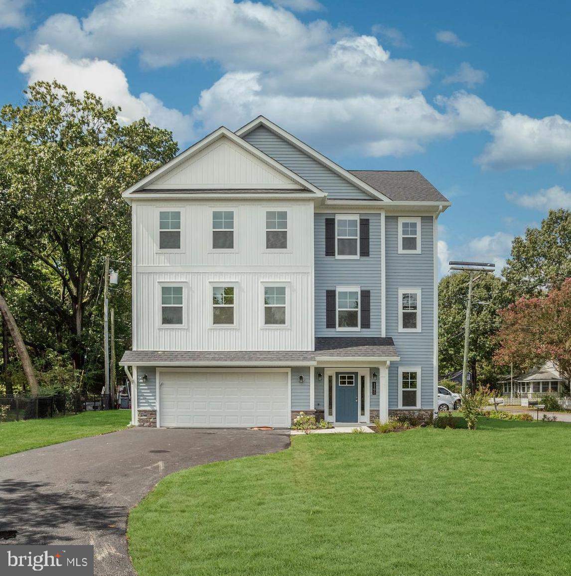This beautifully crafted home blends timeless coastal charm with modern luxury. Featuring classic board and batten siding and a welcoming front porch, the exterior makes a striking first impression. Step inside to an open-concept layout that seamlessly connects the dining and family room, ideal for both everyday living and entertaining.
At the heart of the home is a spacious kitchen boasting an oversized island with quartz countertops, stainless steel appliances, and ample cabinetry—perfect for gatherings or casual meals. A private home office or flexible choice room is conveniently located on the main floor to suit your lifestyle with Water Views!
Upstairs, the serene owner’s suite features a large picture window with a direct view of the Chesapeake Bay, an expansive walk-in closet, and a spa-inspired bathroom with a luxury shower. Located on the corner of Chesapeake and Cedar Avenue across from common area and a short walk to the community pier!