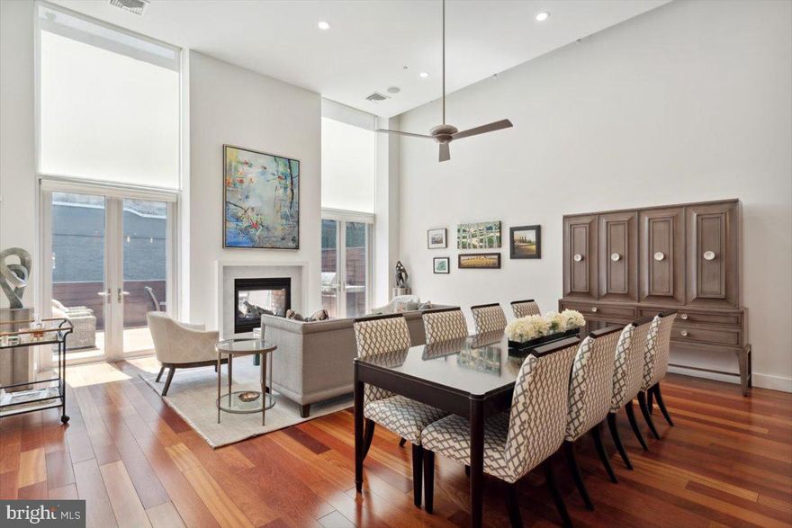 Make this stunning home yours today! Located in the beautiful Logan Square section of Philadelphia, featuring 4 Bedrooms, 3 FULL Bathrooms, 1 Powder room, and 6 CAR PARKING. 2138 Race St is located in the highly sought-after GREENFIELD SCHOOL CATCHMENT. Master craftsmanship and quality materials exude the moment you walk in the door. Enjoy multiple outdoor spaces all on a 21.6 sq. ft wide lot. Take the ELEVATOR from the garage to every level of this home. Or, enter through the beautiful mahogany front door to a stunning well-appointed foyer. Beautiful hardwood floors throughout. Just off of the foyer is a Bedroom with a spacious closet, currently used as a home office. Just a few steps up from the foyer is the open-layout kitchen with stone countertops, Sub-Zero refrigerator, and Viking appliances that opens into a spacious light-filled dining room and great room with soaring 18 Ft ceilings and amazing natural light. Enjoy the double-sided fireplace while relaxing in the living room or, out on the large deck (21.5 ft X 13 ft). A lovely powder room completes this level. Just up from this floor is the mezzanine level with another large living area with double doors to your private balcony (9 ft X 6 ft) overlooking your serene, tree-lined street. The 3rd floor features an oversized family room with a wet bar, 2 additional bedrooms, 2 full bathrooms, and a laundry room complete this level. The top floor offers your expansive Owner's Suite, with a private South-facing terrace (20.5 ft X 7.2 ft), walk-in closet, custom built-in wardrobe, and sitting area. Enter the oversized bathroom with a separate glass shower, 2 separate sinks, and your luxurious tub. This home has it all in a location that can't be beat! Just steps away from the new Giant Supermarket and Whole Foods. Perfectly situated between Rittenhouse Square, The Art Museum, Colleges, Universities, and several of Philadelphia's best restaurants!