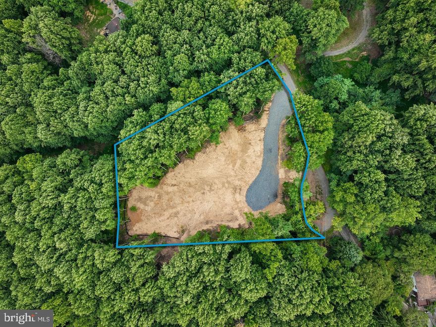 This 1.55 acre wooded lot is situated at the end of a cul-de-sac and is ready for you to build on today, with all the preliminary work already completed, including: recent survey, a RARE 4 bedroom conventional septic letter (from 2023), and electricity on site. The house site location has also been fully cleared, along with a new driveway installed in the spring of 2024. Everything has been done so you can start building NOW! This lot also has a great central location in the Shenandoah Valley, with most attractions such as the Shenandoah National Park, downtown Luray, Massanutten Resort, the Skyline Drive, Luray Caverns, and the Shenandoah River, all within a 30 minute drive. This lot is perfect for a second home, or primary residence. Come check it out before it's gone!