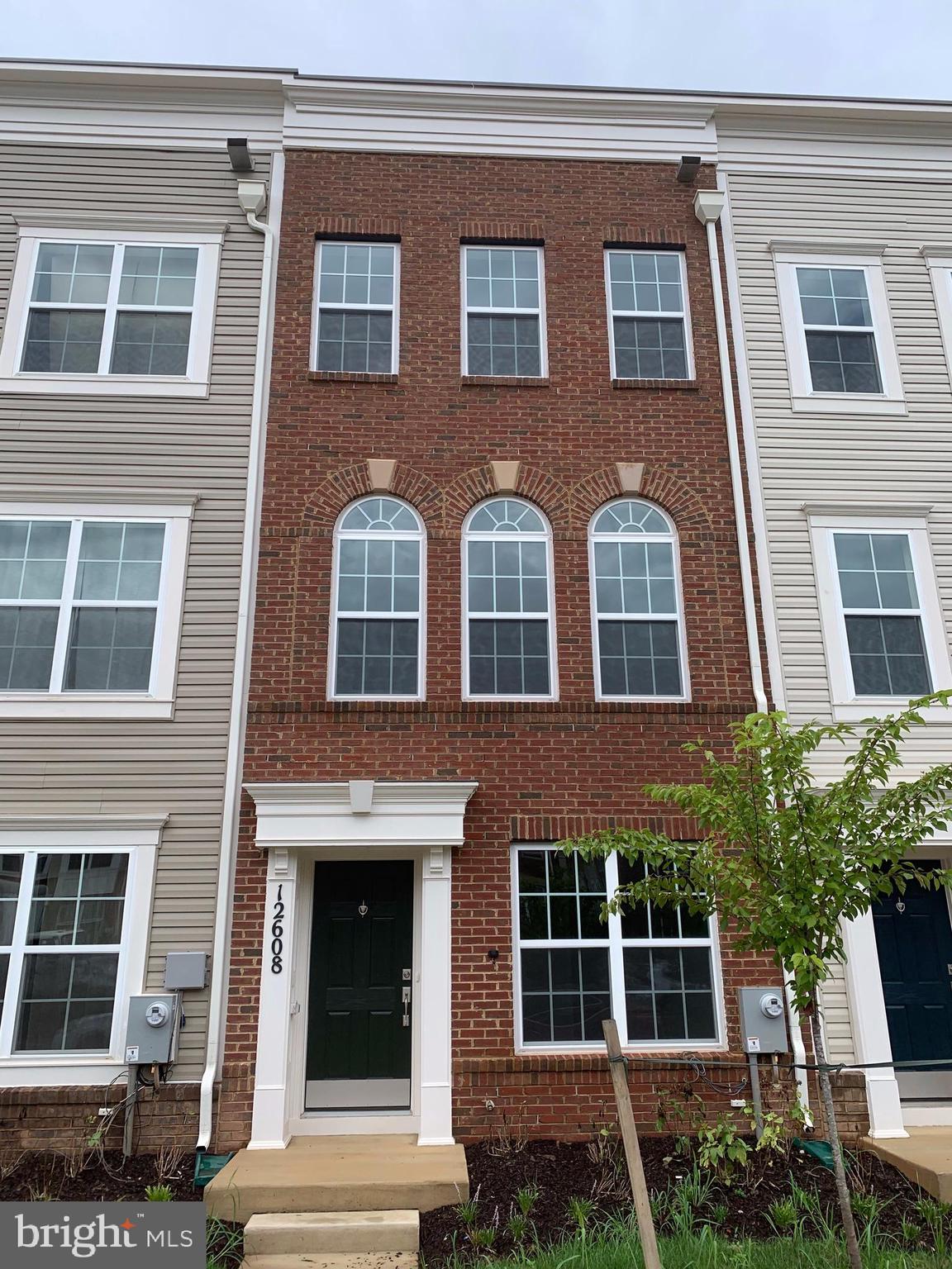 Brand New Construction! This property has never been occupied! 4-level townhouse in Brick Yard Station with rooftop patio and attached garage. Three bedrooms each with their own private bathroom, plus two half baths. Luxury master bathroom w/dual vanities. Open concept kitchen with massive center island, granite countertops, stainless appliances, and sliding door leading to rear deck. The fourth floor has a large bedroom, full bath, second family room/recreational area, and sliding door leading to a large rooftop patio. The first level has a third room, with half bath, that could be used as an additional bedroom, office, etc. Excellent commuter location halfway between D.C and Baltimore, adjacent to Marc Train station, minutes to ICC, I-95, 295, 495, and Rt.1. Community offers a recreational center, lake, gym, pool, and plenty of walking/jogging paths. Nearby Laurel Town Center has dozens of shops, restaurants, and a movie theater. Don't miss out on this one!