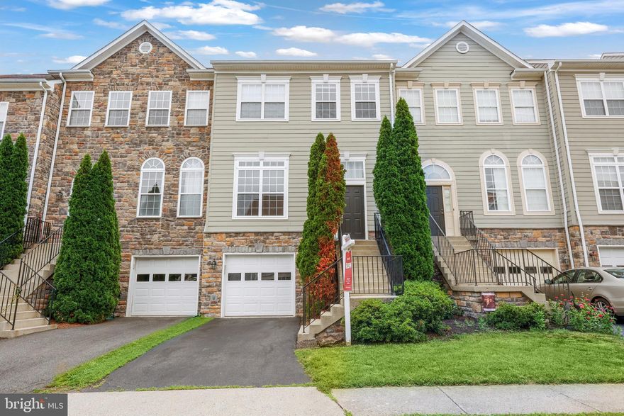 Welcome to this stunning 3-bedroom, 3.5-bath townhouse in the highly sought-after Potomac Crossing community of Leesburg! This beautifully maintained home offers an open layout filled with natural light. The spacious kitchen features a massive center island, stainless steel appliances, and gas cooking—perfect for both everyday living and entertaining. The bright living room provides a comfortable space to relax and unwind. Upstairs, you'll find three generously sized bedrooms, including a primary suite with a deep walk-in closet and a luxurious ensuite bath featuring a dual sink vanity, walk-in shower, and soaking tub. The upper-level laundry room includes custom shelving for added storage and convenience. The finished basement boasts a cozy gas fireplace, a full bathroom, and walk-out access to the fully fenced backyard—ideal for gatherings or quiet evenings. Enjoy outdoor living on the deck overlooking the yard. Additional highlights include a one-car garage and a fantastic location close to parks, shopping, and commuter routes. Don't miss your chance to tour this gem!