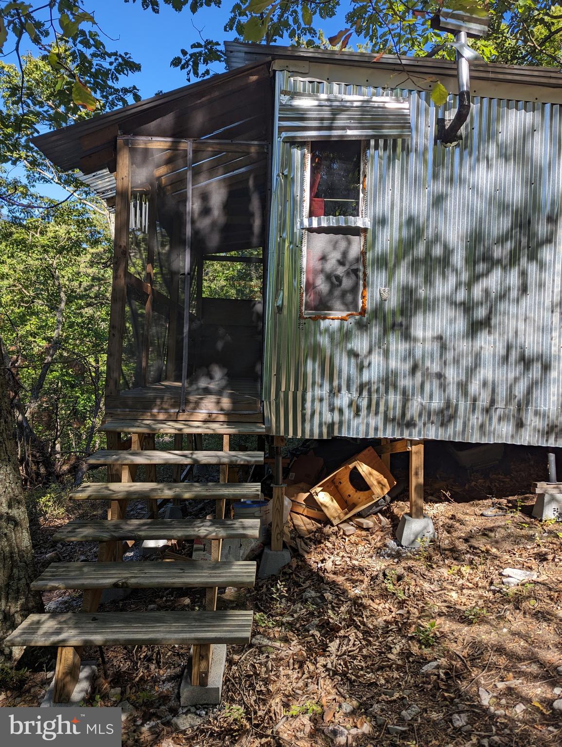 5.495 Hard wooded acres boarding 2,500 acre Sidling Mt. Wildlife Management Area. Improved by cozy shed. Choose your building site with possible seasonal view. Deeded protective covenants and restrictions. All located in rural Cacapon Highlands subdivision with good road access. $50,000.