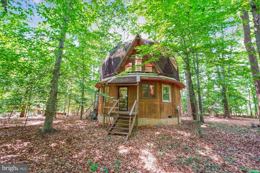 Fantastic Opportunity to build an idyllic home in the forest close to Washington DC. There is a Geodesic Dome on 6805 Simms Mill Place in the middle of the forest and a 6,400 SF warehouse on 6830 Simms Mill Place across the street. The Geodesic Dome House was designed to have as much natural light as possible, and a feeling of space. Some people love it and feel inspired by it. The finishes are mostly rustic, or absent. You can think of that aspect as a blank palette. The building is sound, and carefully designed. The first floor has vertical walls 10’ high, and on top of that is the upstairs (3/5 of a pie, so 2/5 of the downstairs has effectively a 24’ ceiling. There are provisions in the Conservation Easement to build a new home within a specified area of up to 3,000 FSF. This property is being sold together with an adjacent parcel for a total of approximately 30 acres, near the Moyaone Reserve in Charles County. The Conservation Easement on the property to preserve the natural habitat and character of the property, which requires one owner for both 6805 and 6830 Simms Mill Place, Bryans Road, Maryland 20616. The Property is identified on tax map 5 parcels 315, 416 and 464. 
Please contact the listing agent for a copy of the Conservation Easement registered with the Maryland Environmental Trust and the Conservancy for Charles County.