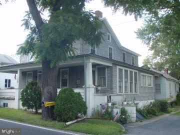 Nice level land parcel. Approximately 1.5 acres wooded. Old farm house, fair condition. Property needs work and new owner. Priced accordingly. Sold "AS IS".