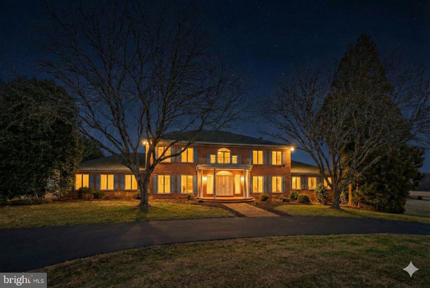 Proudly introducing the Lewis Family Farm - Set on 94.27 acres of pristine pastureland, 6005 Ten Oaks Road stands as one of the final remaining legacy estates in the heart of Clarksville, Maryland. This extraordinary property embodies the region’s equestrian heritage, offering unmatched acreage, privacy, and potential in one of Howard County’s most coveted settings. With its combination of open fields, functional farm structures, and an elegant estate residence, this offering presents a once-in-a-lifetime opportunity to secure and shape a piece of Howard County history. The main residence spans approximately 7,000 finished square feet and was thoughtfully designed with timeless architectural elements and an inviting flow that lends itself to both everyday living and large-scale entertaining. The grand foyer, complete with a curved staircase and soaring ceilings, makes an immediate statement upon entry. To one side, a spacious formal dining room provides the perfect backdrop for hosting holidays and celebrations, while generous living and family spaces offer warmth and comfort enhanced by abundant natural light and scenic views. The home’s first-floor primary suite serves as a true retreat, featuring ample space for both rest and relaxation, while offering convenient access to the main living areas. Upstairs, additional bedrooms and flexible living spaces provide room for family and guests alike. The lower level includes a kitchenette and entertainment area, ideal for extended stays, gatherings, or potential guest quarters. While the home would benefit from thoughtful updates, its solid construction, scale, and flow make it an exceptional canvas for a discerning buyer to modernize and personalize. This property has hosted an extensive amount of large-scale events, family gatherings, and several weddings.  Outside, the property’s beauty unfolds across rolling pastures, multiple run-in sheds and stalls, and a large pole barn, creating a fully functional environment for equestrian pursuits or hobby farming. The property famously hosted twelve Ten Oaks Cup Polo matches over the years that drew in over 1,000 guests. The events successfully met the family’s fundraising goals for Our Daily Bread, a food kitchen in Baltimore where Mary Agnes served for decades. The five-car garage and circular driveway complement the estate’s stature, while the extensive hardscaping on the rear of the home provides an elegant setting for outdoor entertaining, relaxation, or simply enjoying panoramic views of the surrounding countryside. This is more than a property— it’s an opportunity to create a generational estate with endless potential for restoration, recreation, and refinement. Whether you envision a modern equestrian facility, a private sanctuary, or a showcase of fine country living, 6005 Ten Oaks Road offers the land, the legacy, and the location to make it a reality. A rare find in today’s market, this estate represents the final chapter of Clarksville’s grand pastoral properties—an invitation to preserve the past while crafting a visionary future in the heart of Howard County. Please reach out directly for details on equine features. **Important; this property is not subdividable - Buyers, please feel free to contact Joy Levy, Program Administrator, Howard County Agricultural Land Preservation Program (ALPP) for details on permissible uses.**