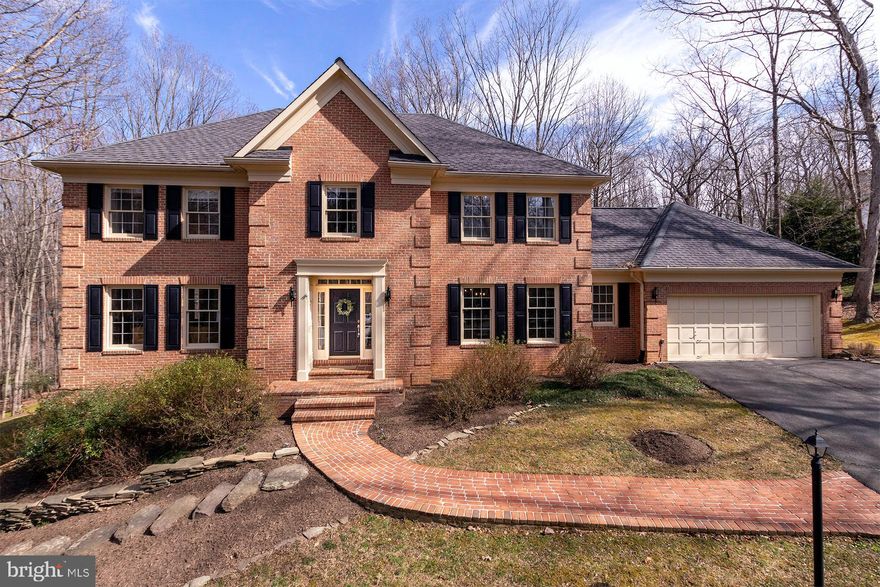 Stunning all brick home on .92 acres in prestigious Hunters Valley. Luxury abounds with 4 bedrooms, 3.5 baths and a 2 car garage. An entertainers dream with a gourmet kitchen, breakfast room, family room with gas fireplace, dining room, living room and sun room. Executive home office/library with built-ins and bay window. Luxurious owners suite with dual walk-in closets and a remodeled spa-like bath with glass enclosed rain shower and free standing tub. Three additional bedrooms on the upper level with an updated full bath. Finished walk-out basement with recreation room, gas fireplace, den, storage room and updated full bath. Expansive deck, patio and park-like yard surrounded by trees. Located in a secluded equestrian neighborhood minutes from walking trails, Tysons Corner, downtown Vienna, Reston and commuter routes.